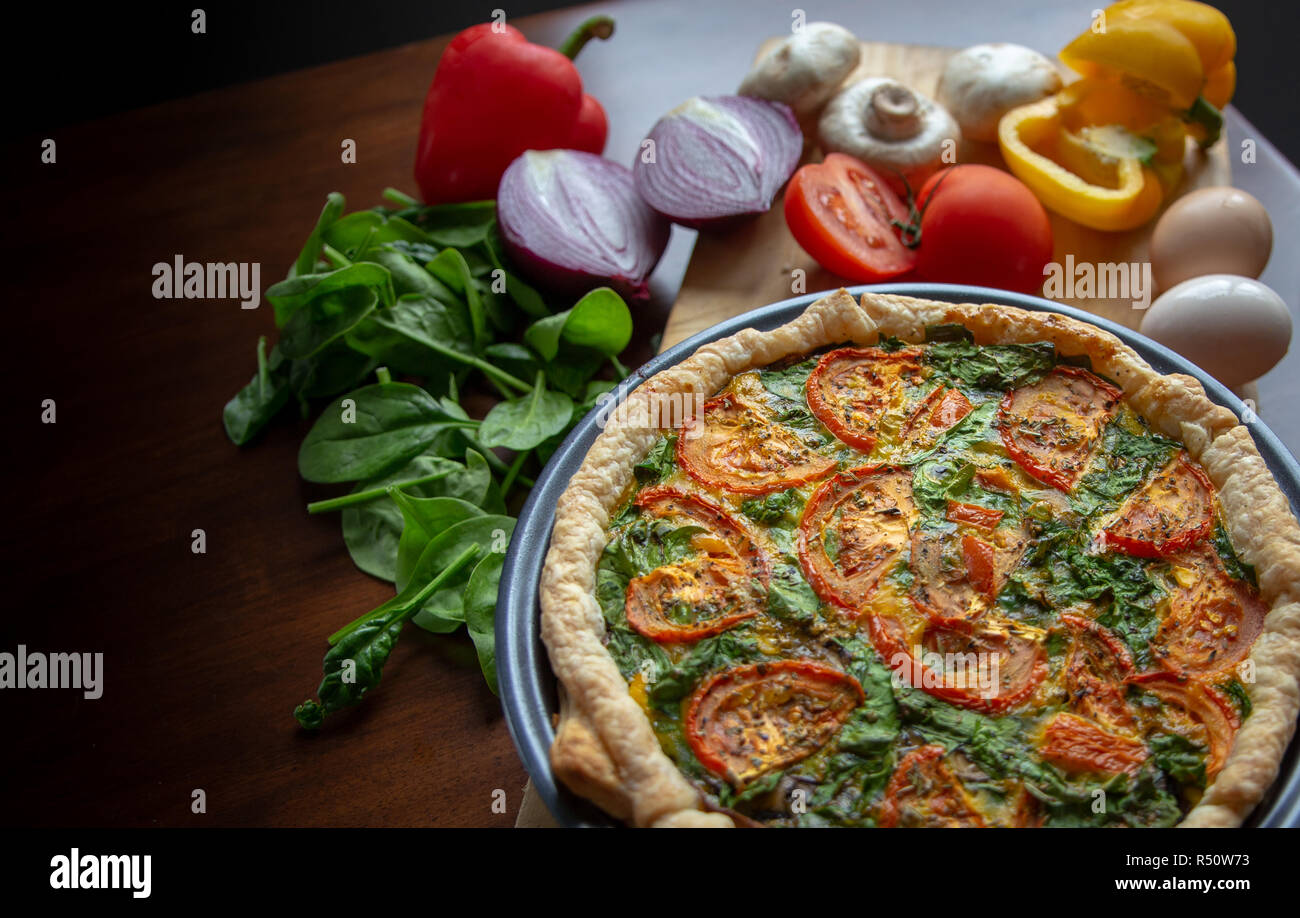 Fresh vegetables and free range eggs are ingredients in a healthy homemade quiche Stock Photo