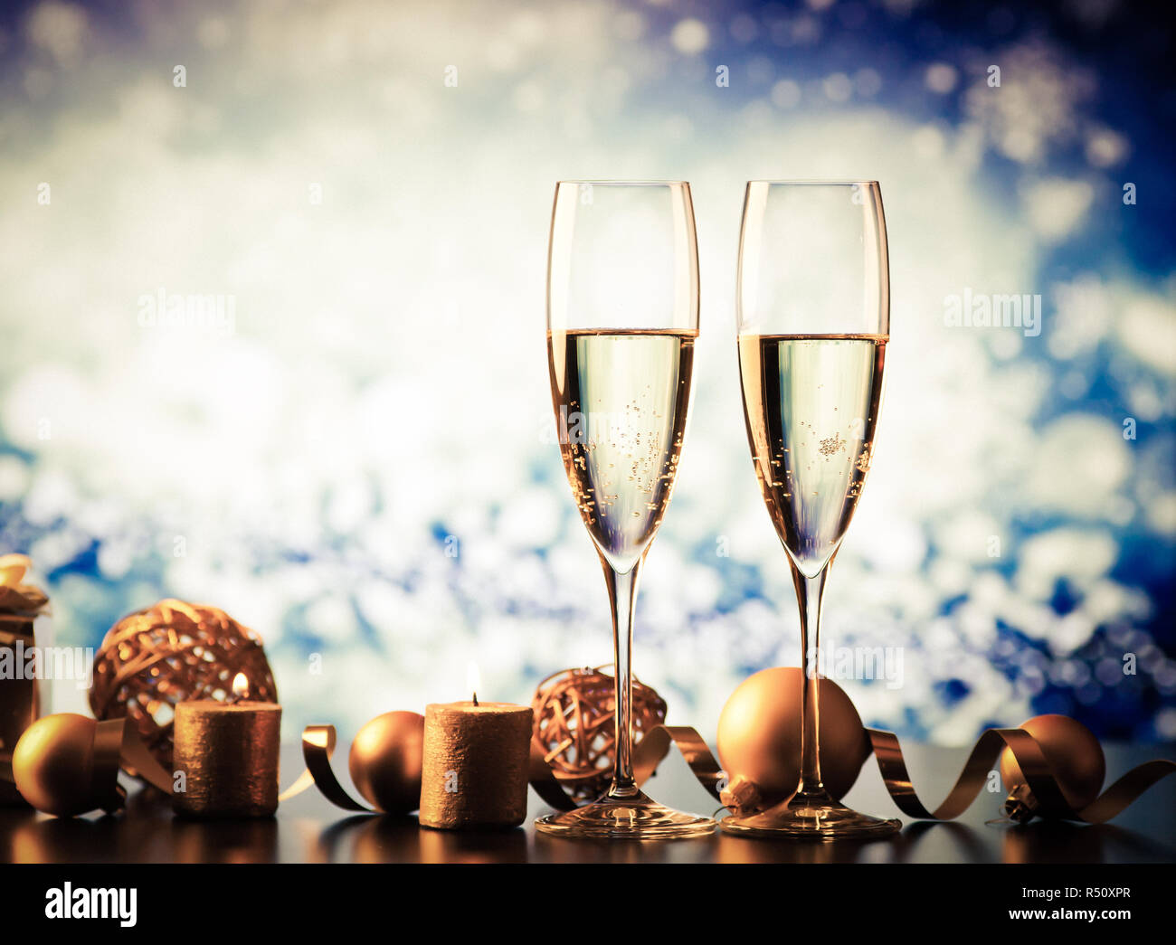 Two champagne glasses splash with drops hi-res stock photography and ...