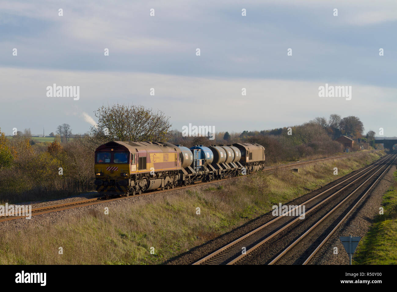 A pair of class 66 diesel locomotives numbers 66239 and 66042 top and tailing a rail head treatment train at Irchester on the Midland Main Line. Stock Photo