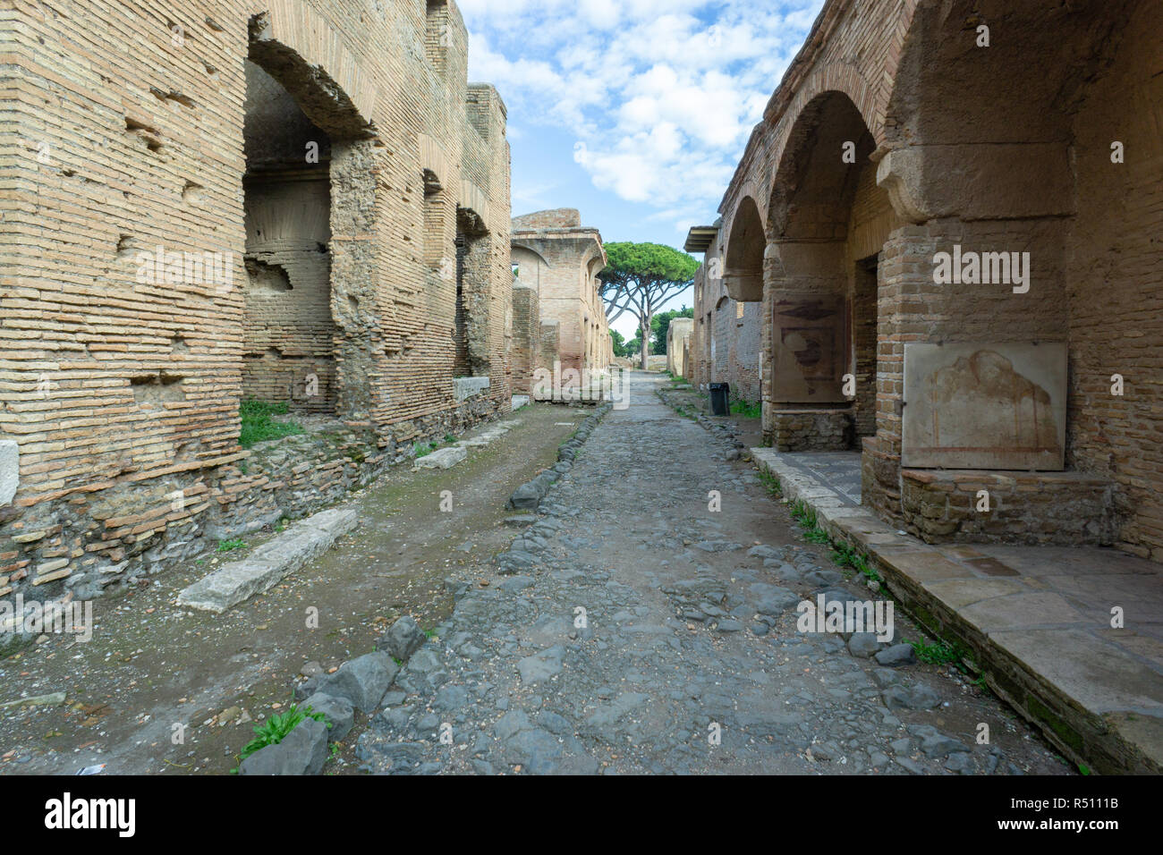 Ostia antica in Rome, Italy. Archaeological Roman empire street view with original ancient Roman buildings Stock Photo