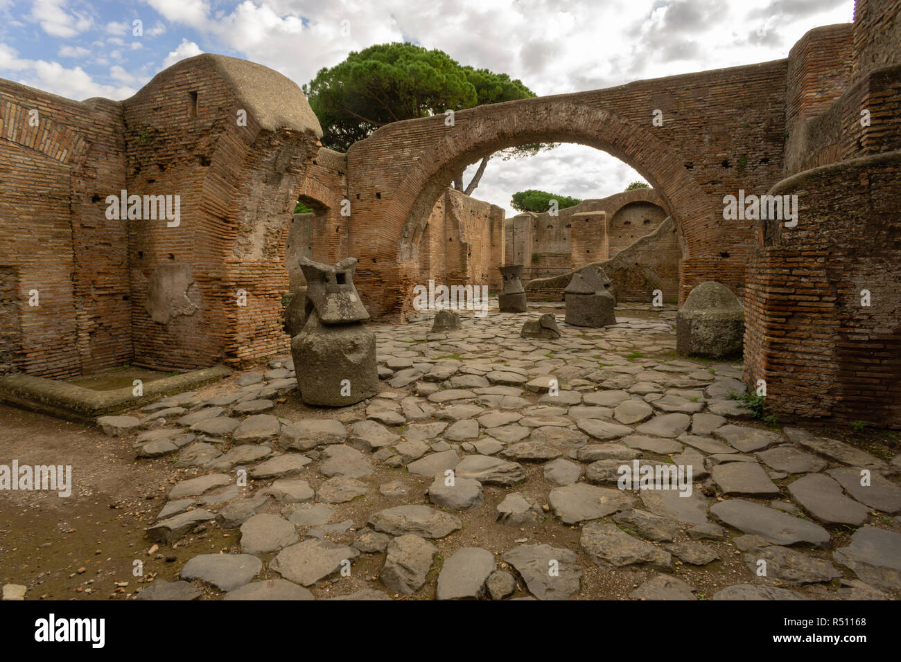 Ostia antica in Rome, Italy. Palace of Molini with lava millstones Stock Photo
