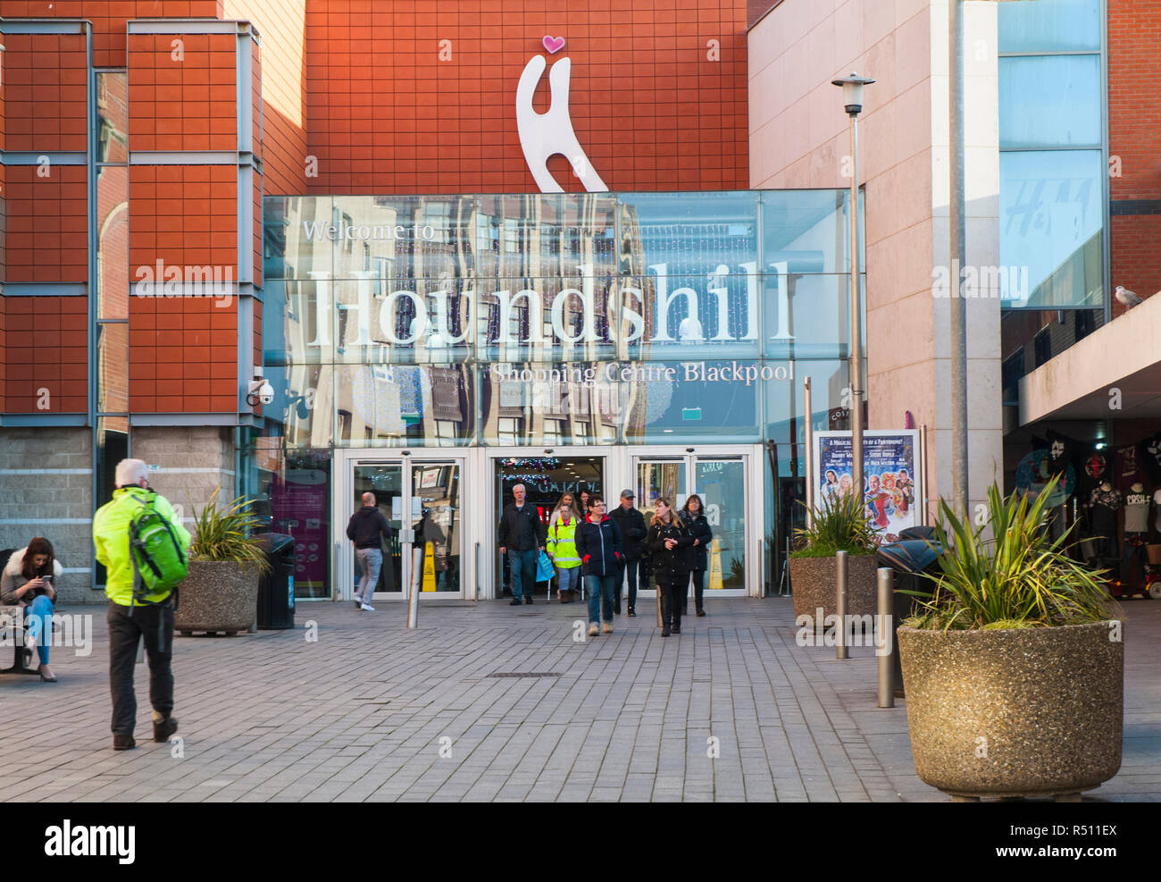Shoppers entering and leaving entrance to HoundsHill Shopping Centre