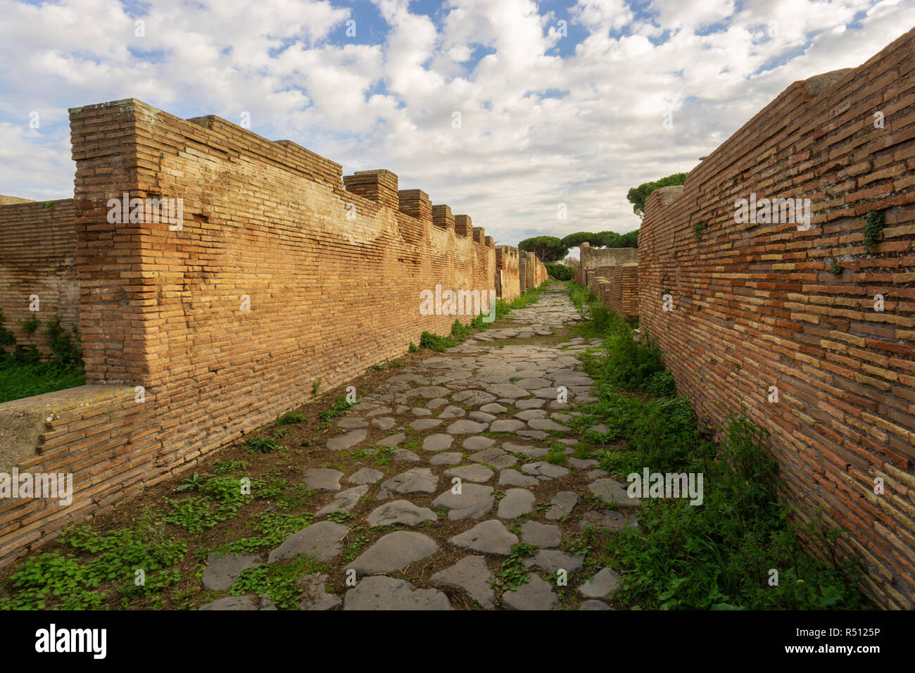 Ostia antica in Rome, Italy. Archaeological Roman empire street view with original ancient Roman buildings Stock Photo