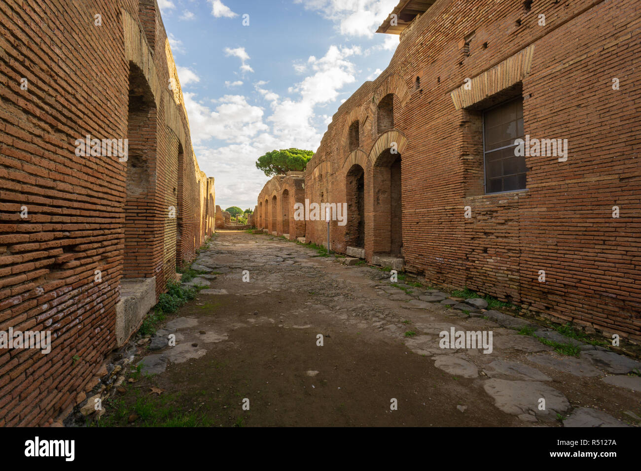 Ostia antica in Rome, Italy. Archaeological Roman empire street view with original ancient Roman buildings Stock Photo