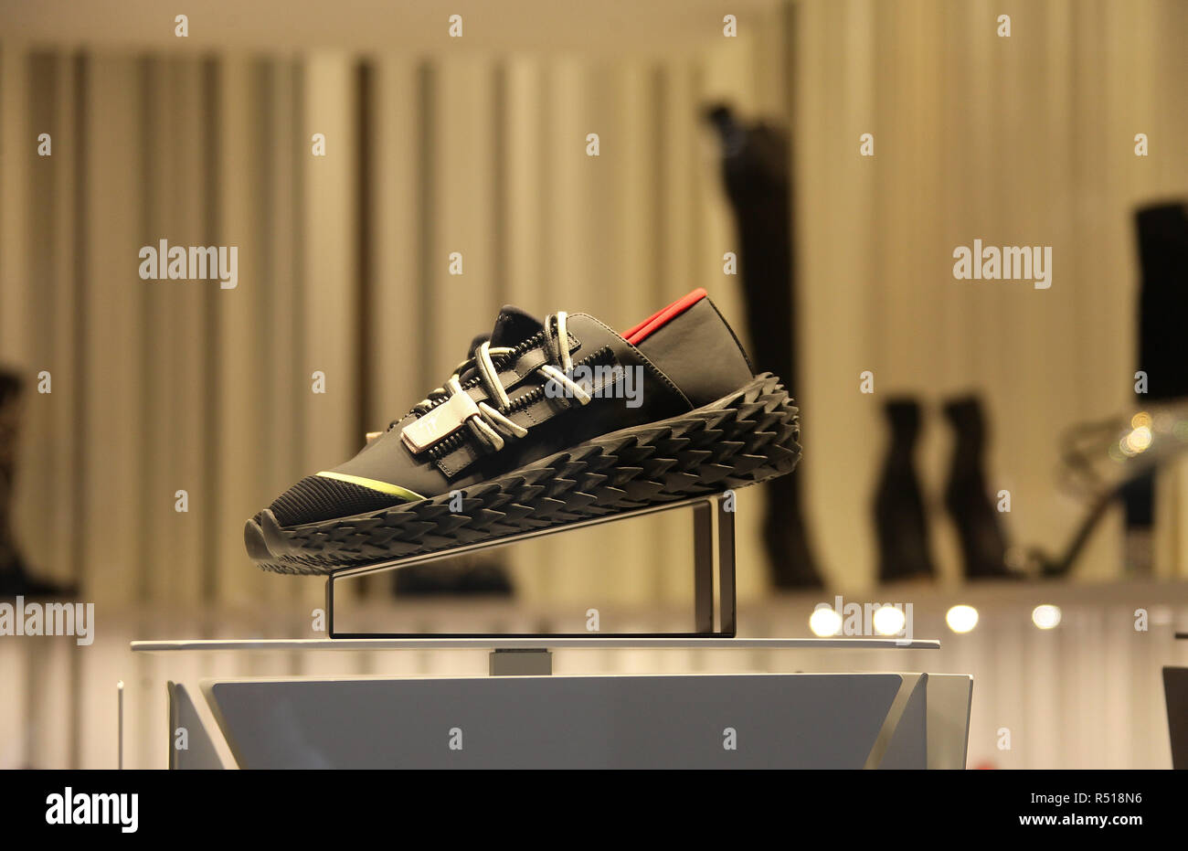 Window of the Giuseppe Zanotti store in Venice and a display of their new  Urchin sneakers Stock Photo - Alamy