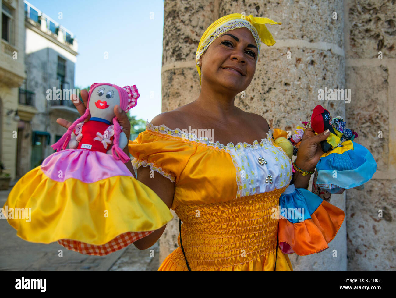 Cuban woman selling dolls to tourists. Stock Photo
