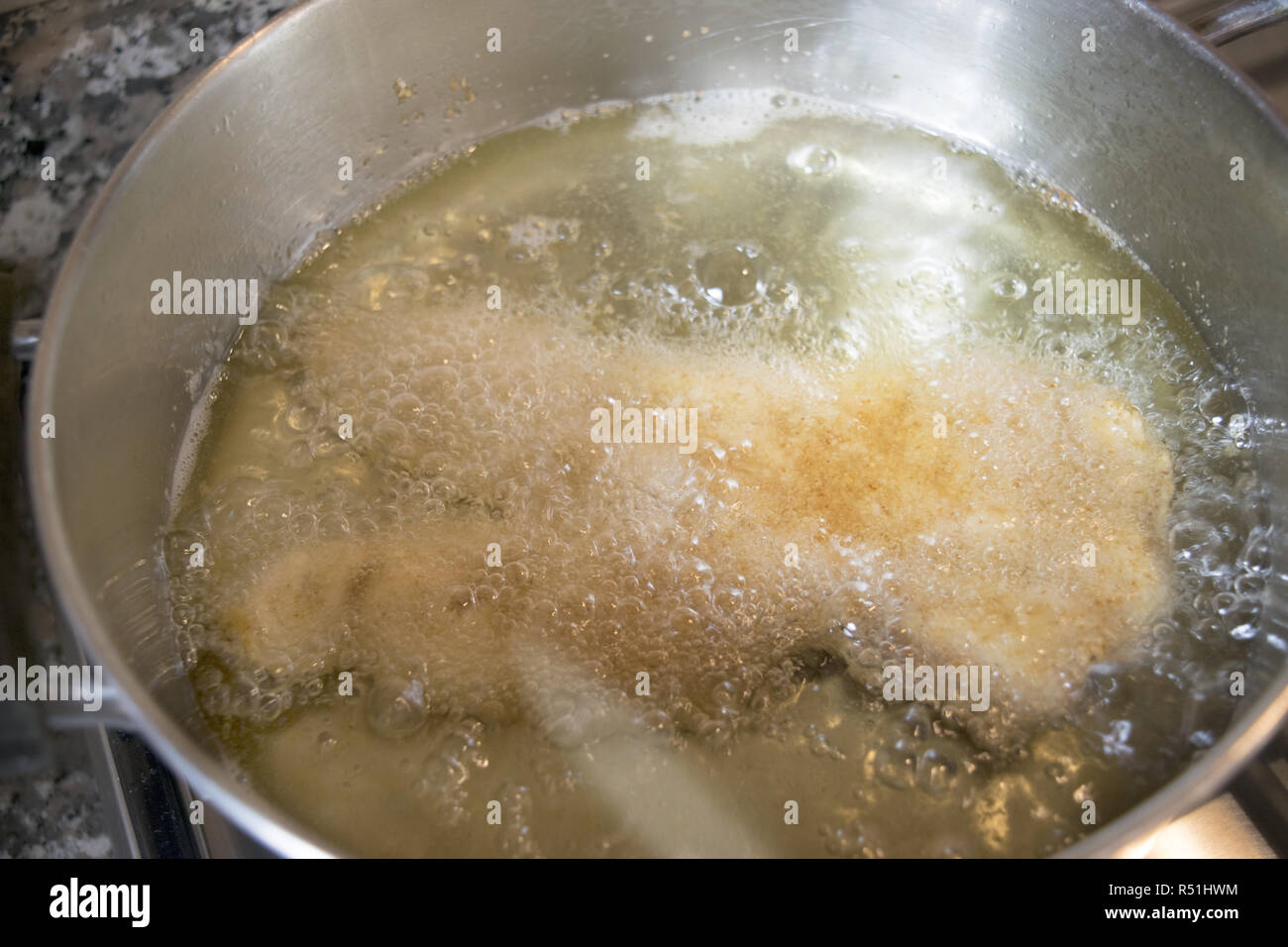 chicken cutlet fried in olive oil Stock Photo Alamy