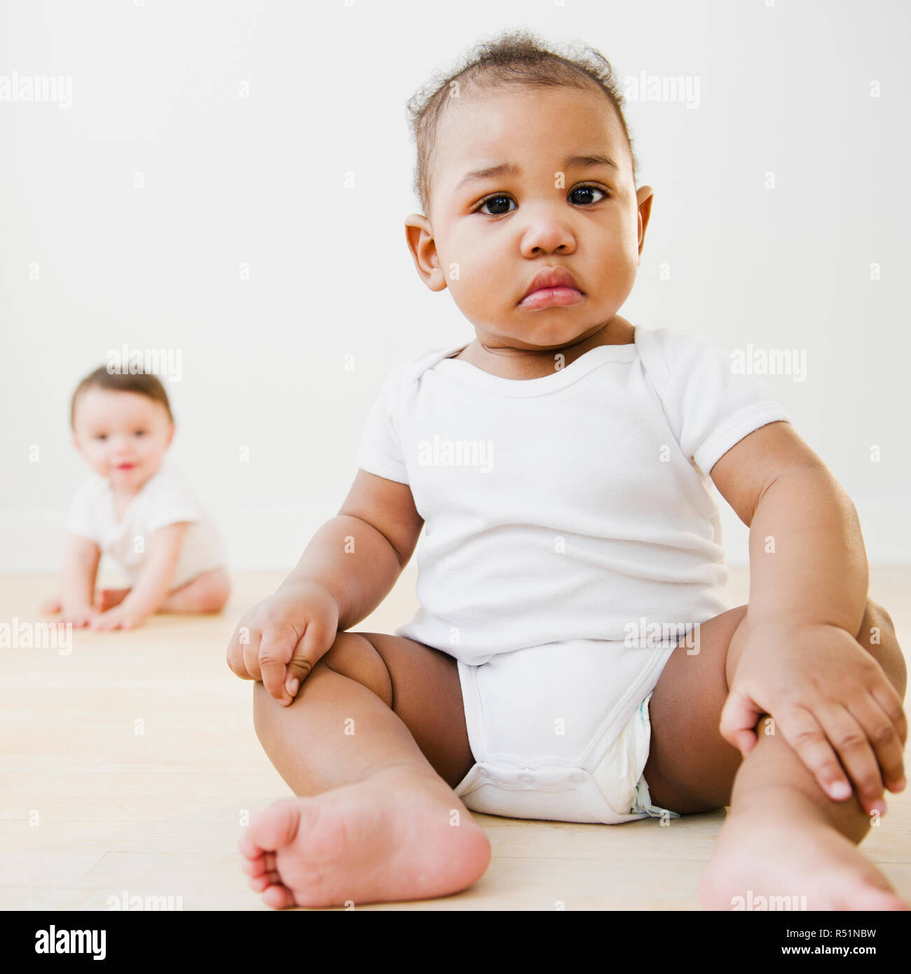 Baby nappy sitting mixed race hires stock photography and images Alamy