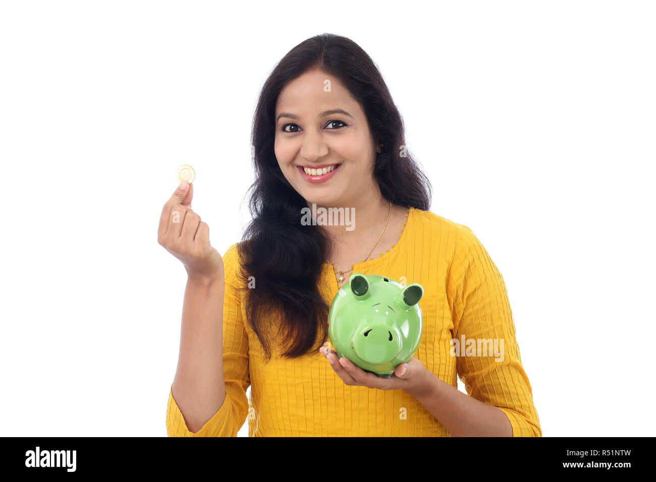 Young Indian Woman Saves Money in Piggy bank Stock Photo - Alamy