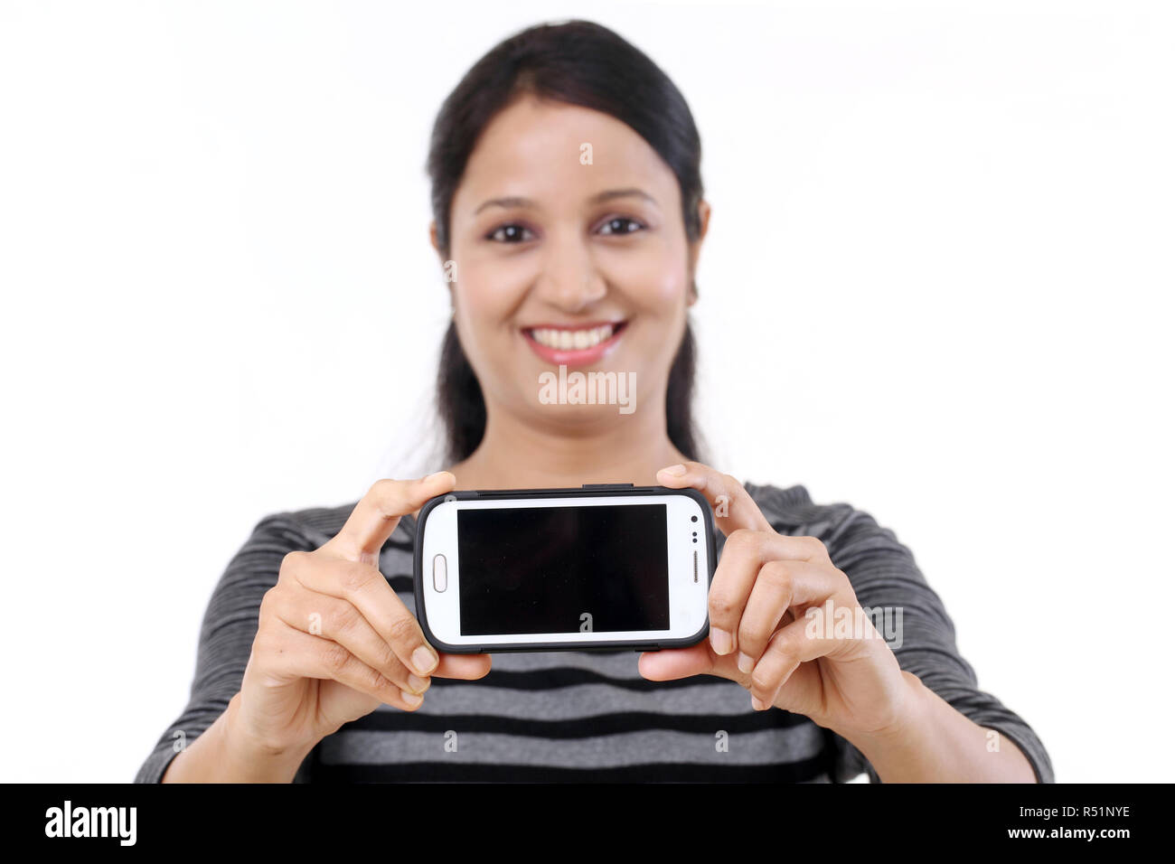 Happy young woman taking a selfie Stock Photo - Alamy