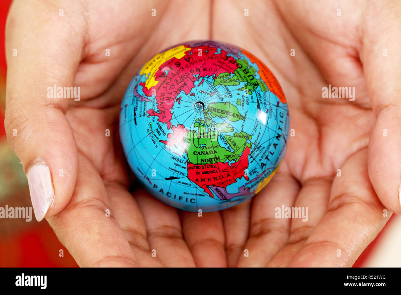 Woman holding globe on her hands Stock Photo