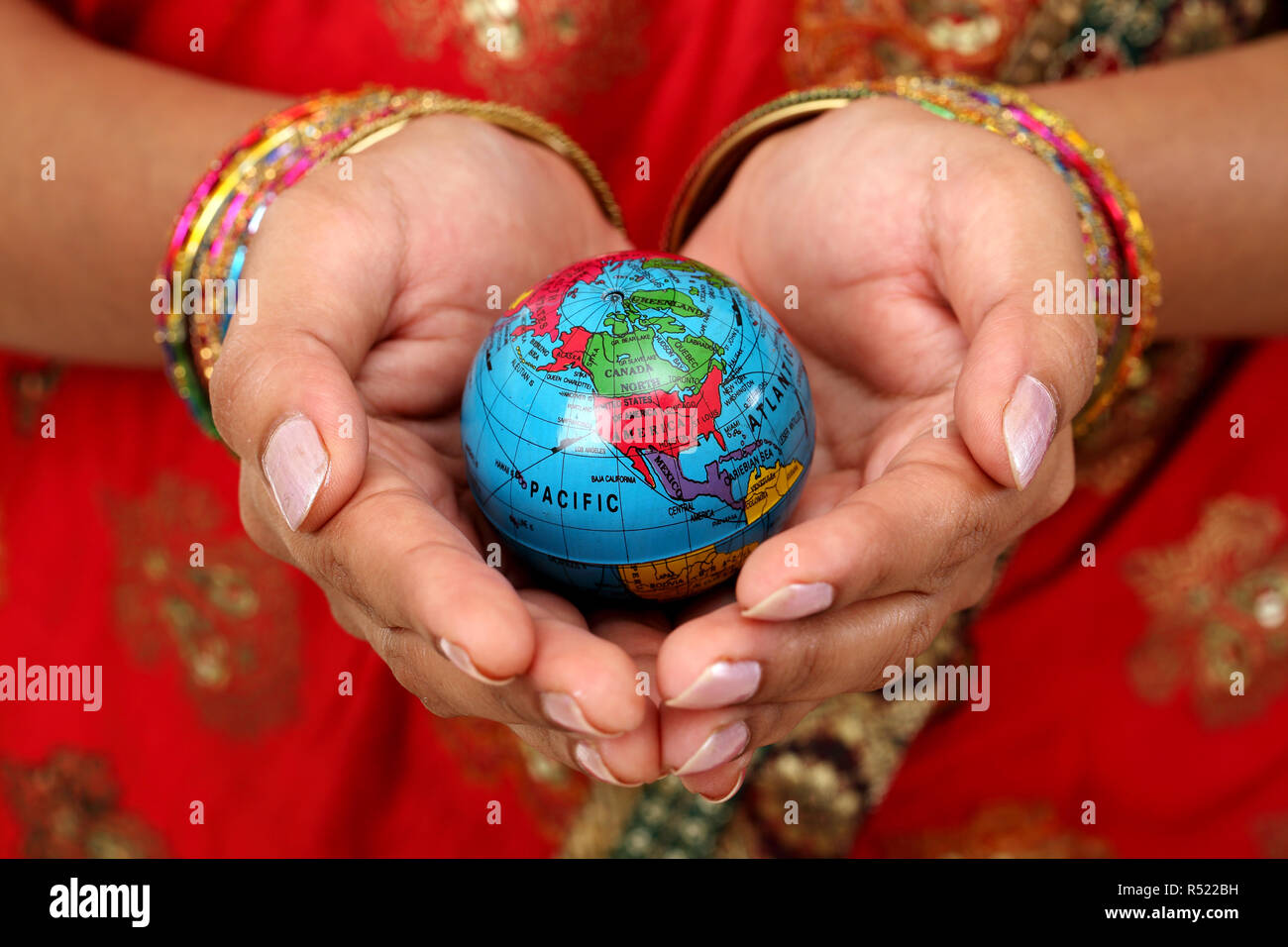 Woman holding globe on hands hi-res stock photography and images - Alamy