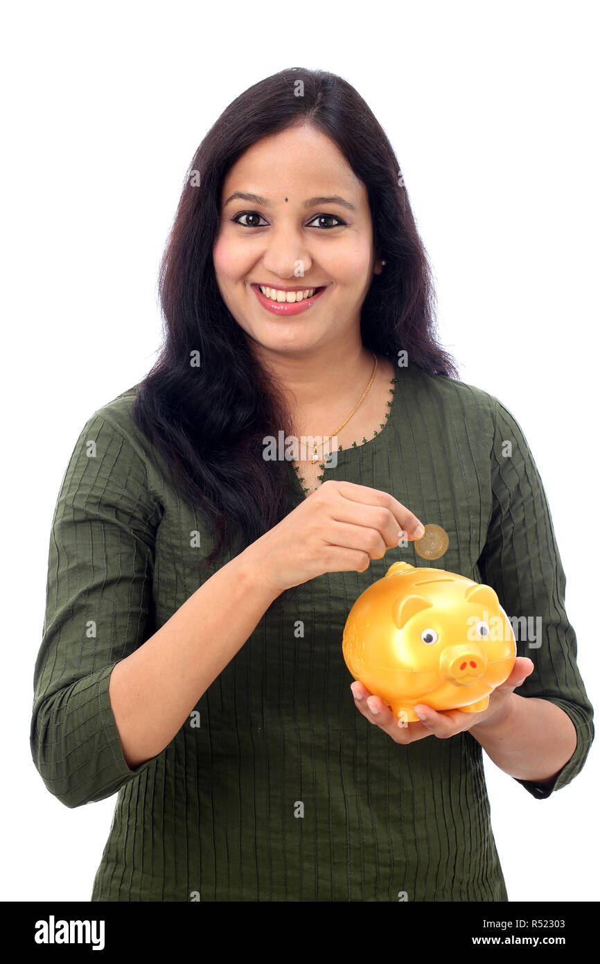 Young Indian Woman Saves Money in Piggy bank Stock Photo - Alamy