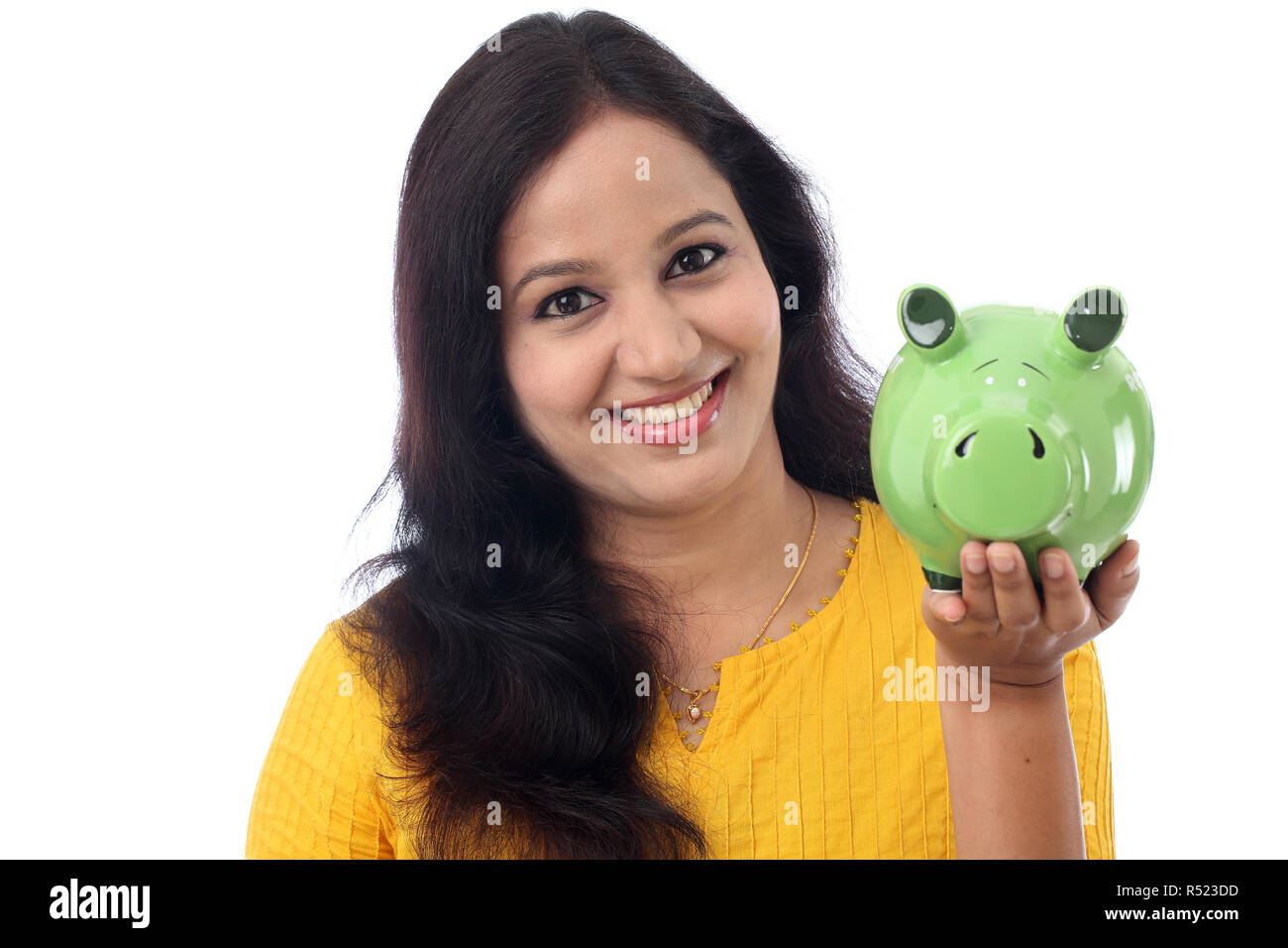 Young Indian Woman Saves Money in Piggy bank Stock Photo - Alamy