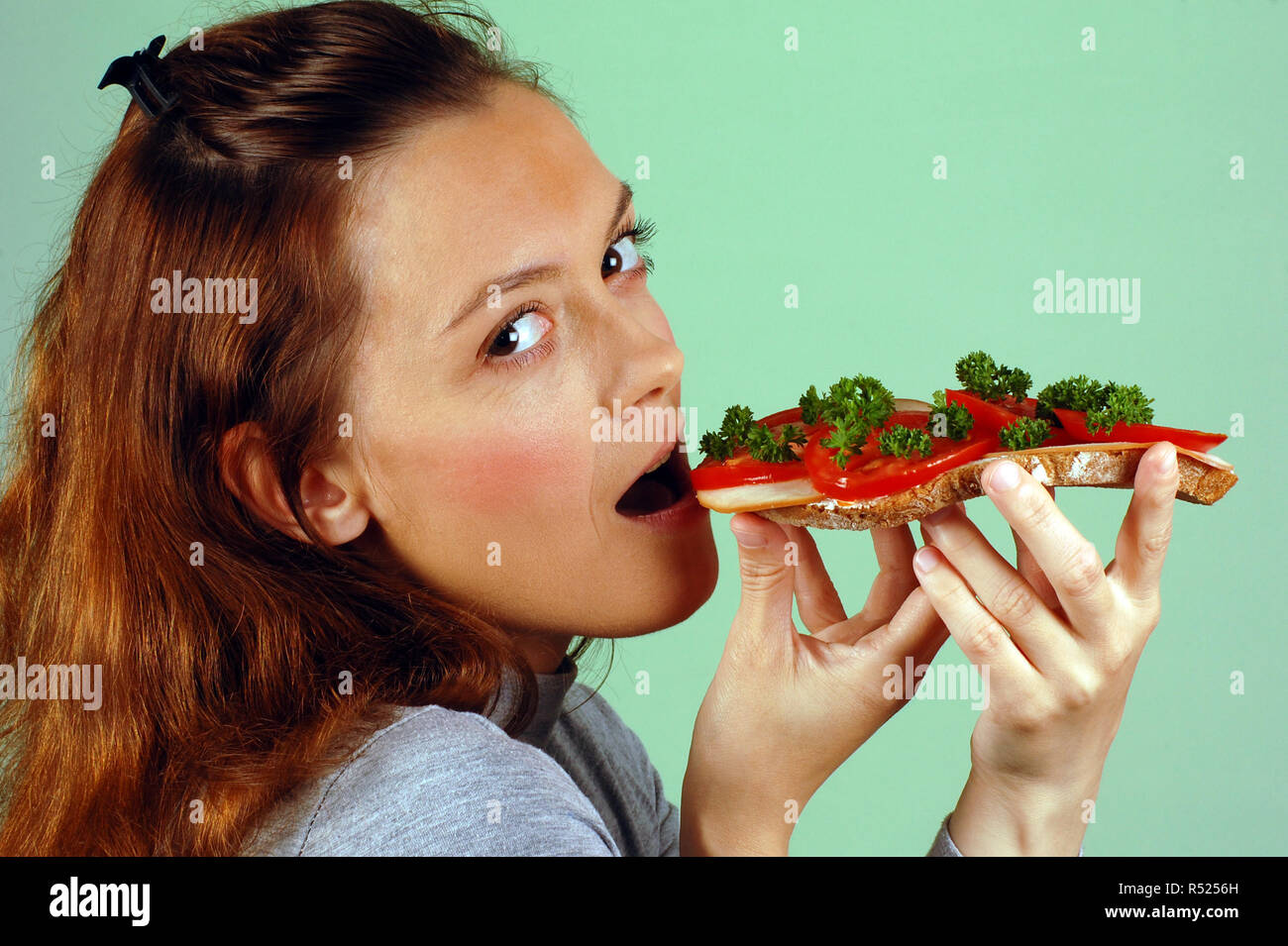 woman eats sandwich Stock Photo Alamy