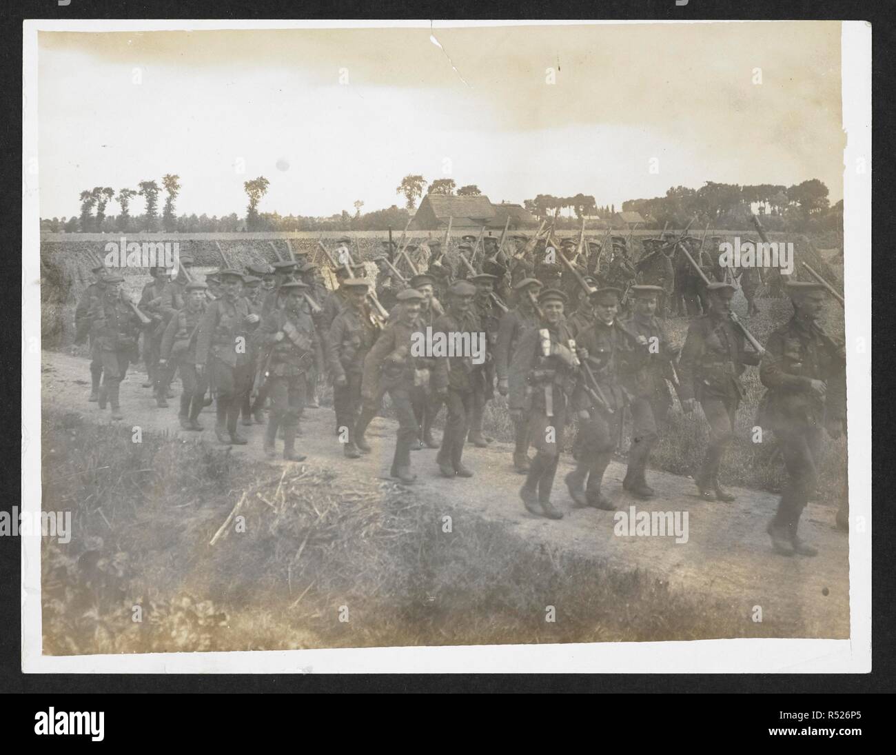 WW1 UK photo Manchester Regiment marching down winter road France WW1 UK photo Manchester Regiment marching down winter road France