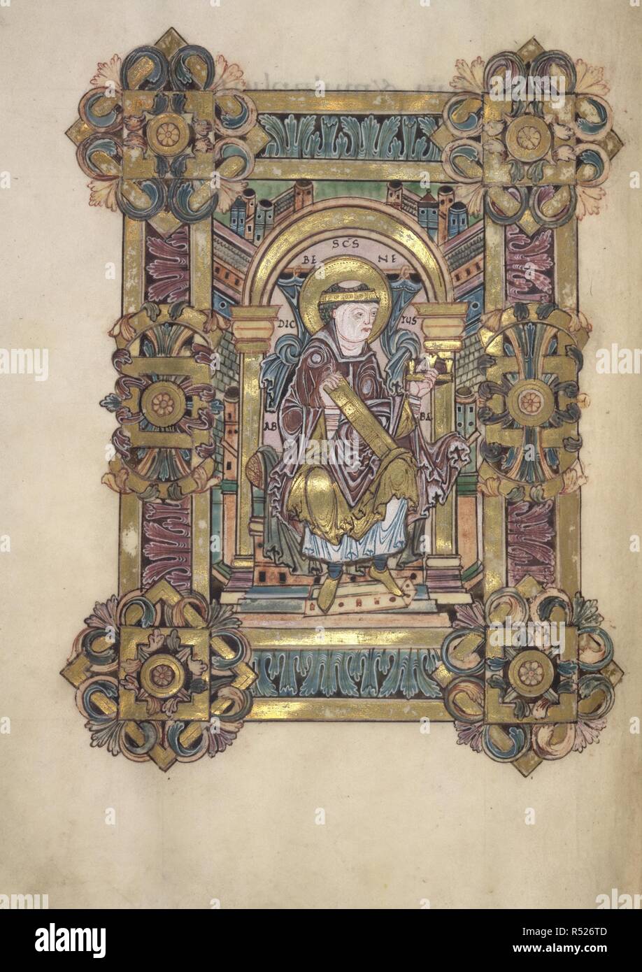 [Whole folio] Preface to the blessing for the Feast of St. Benedict, 11 July. St. Benedict,identified by an inscription reading: 'S[an]c[tu]s Benedictus Abbas' is enthroned under a curtained arch, with the background either side filled with architectural motifs. He has a golden fillet, representing the crown of life, round his head, and is dressed in Mass vestments. He holds a golden book, presumably his Rule, on his knee, and proffers a golden crown. In the background are buildings symbolizing the Kingdom of Heaven.  The miniature is set in a frame of 'Winchester' acanthus, with round corner  Stock Photo
