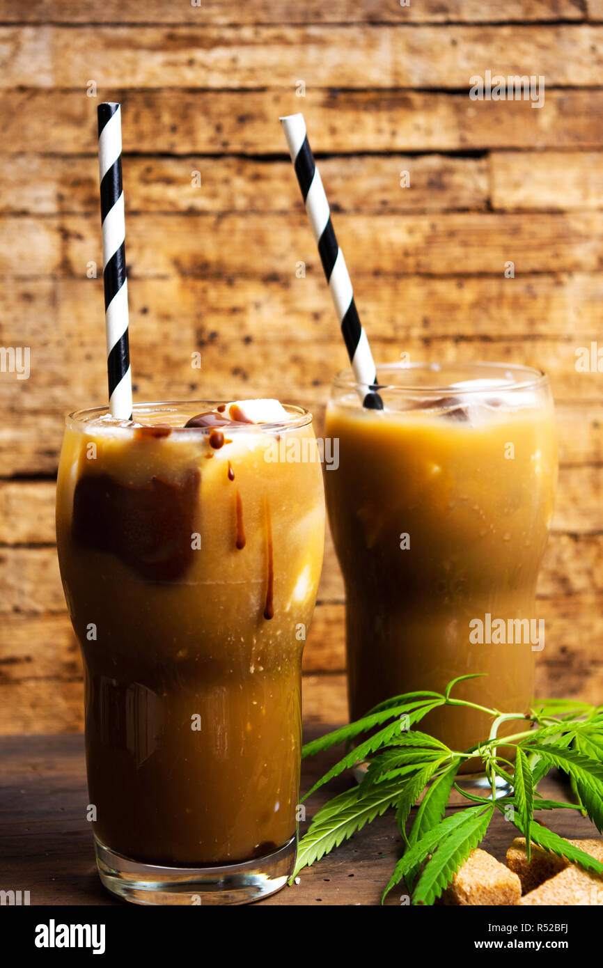 Mocha coffee with marijuana in a high drinking glass Stock Photo
