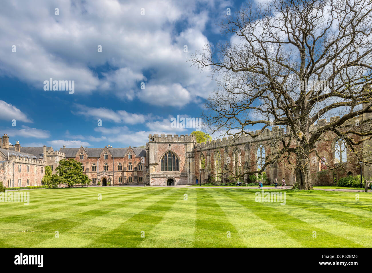 The Bishop's Palace in Wells, Somerset, with its manicured lawn and gardens is a popular tourist destination. Stock Photo
