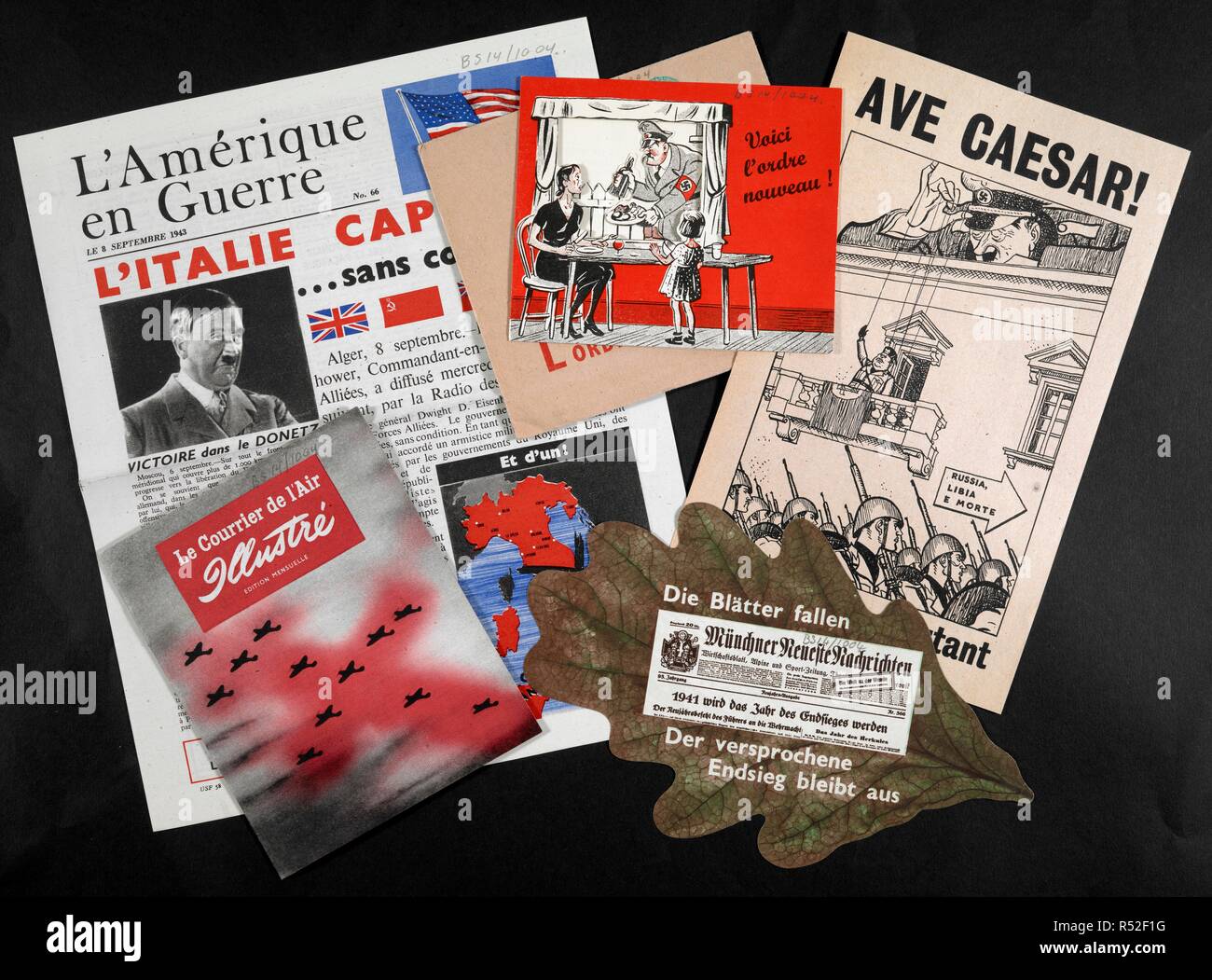 A display of various leaflets and magazines. [A collection of leaflets and magazines initiated by the Political Intelligence Department of the Foreign Office, the Office of War Information, United States and the Psychological Warfare Division of the Supreme Headquarters, Allied Expeditionary Force and dropped by United Kingdom based aircraft during World War II over Belgium, Channel Islands, Czechoslovakia, Denmark, France, Germany, Holland, Italy, Luxembourg, Norway and Poland for purposes of propaganda, together with an index.]. Great Britain. Foreign Office. Political Intelligence Dept. [19 Stock Photo