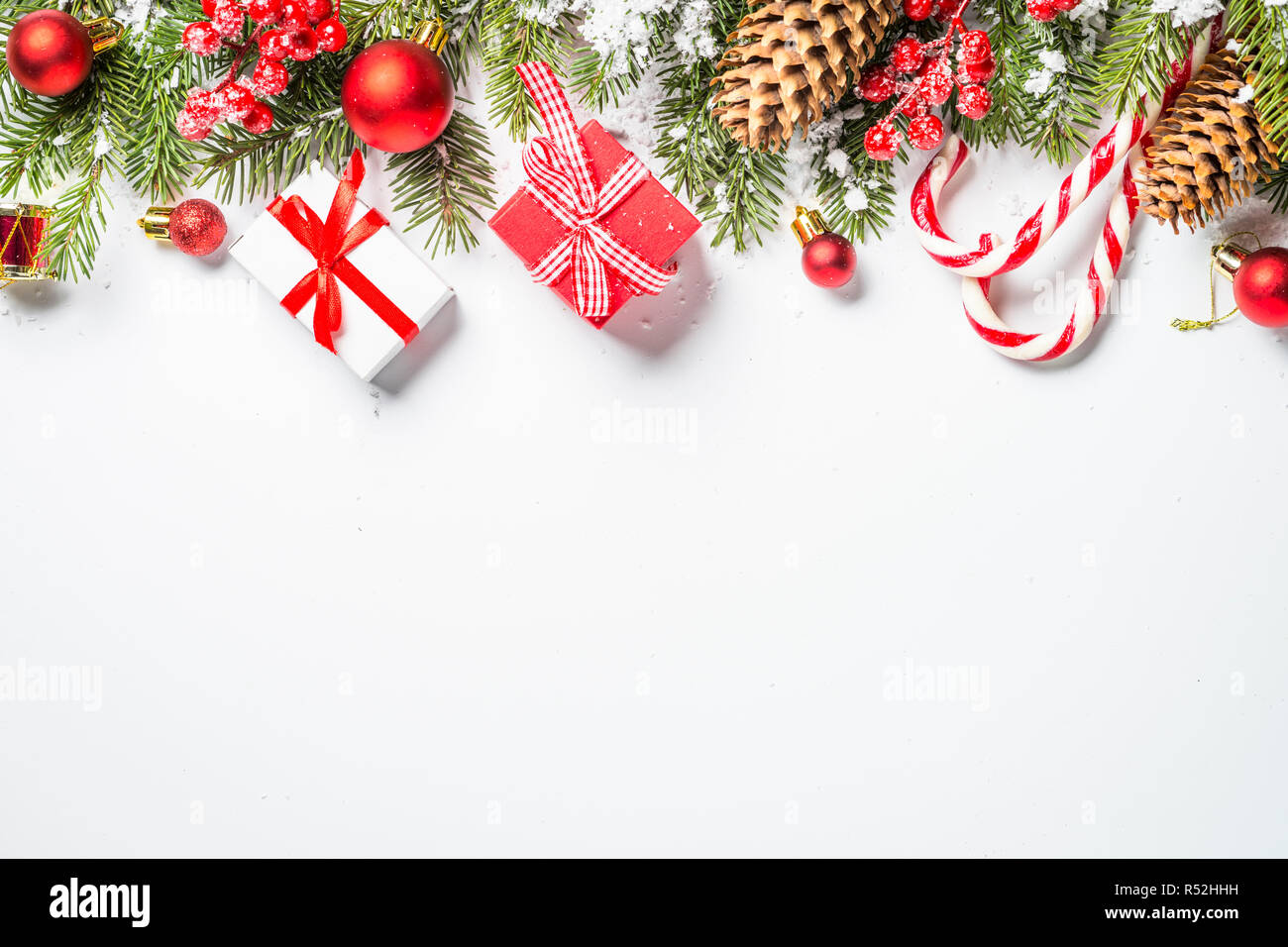 Christmas background with fir tree and decorations on white Stock Photo ...
