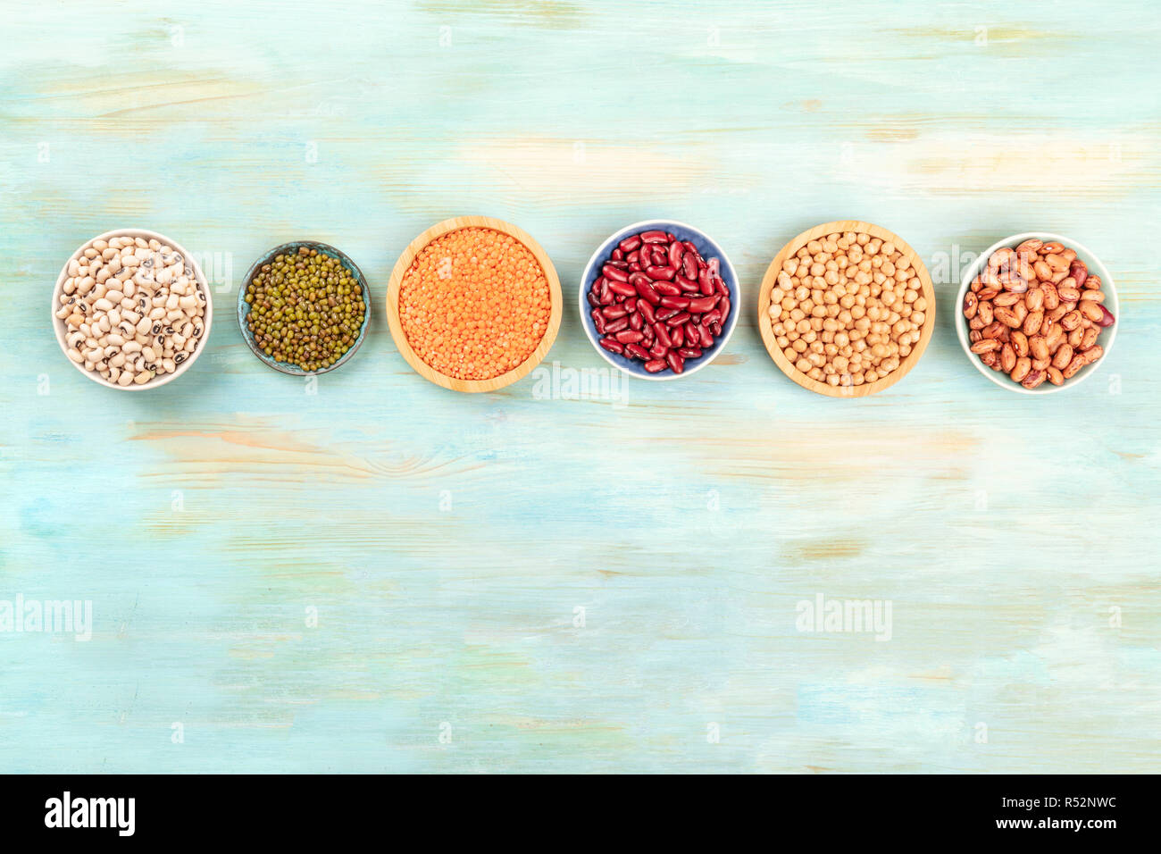 Red Color Pulses Various types of pulses, shot from above on a teal background with copy ...