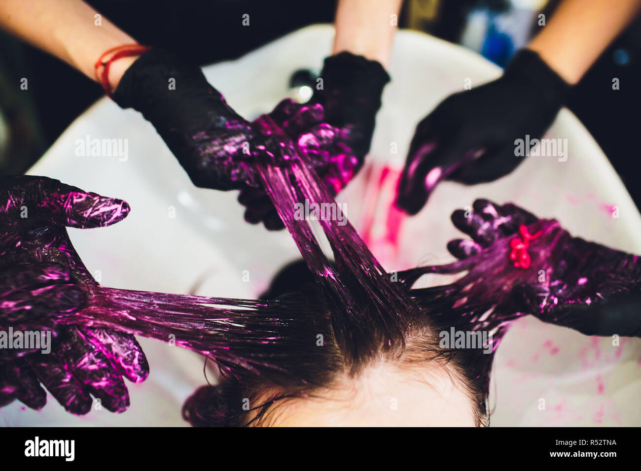 Beautician dying hair of woman. Girl in beauty salon Stock Photo Alamy