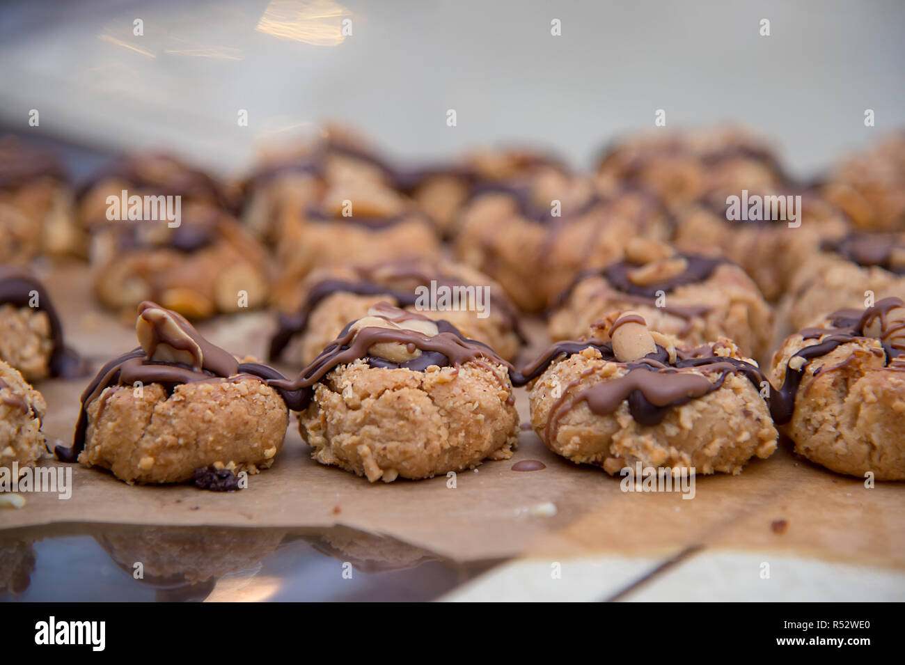 On Baking Paper Are Many Small Biscuits Peanuts And Chocolate