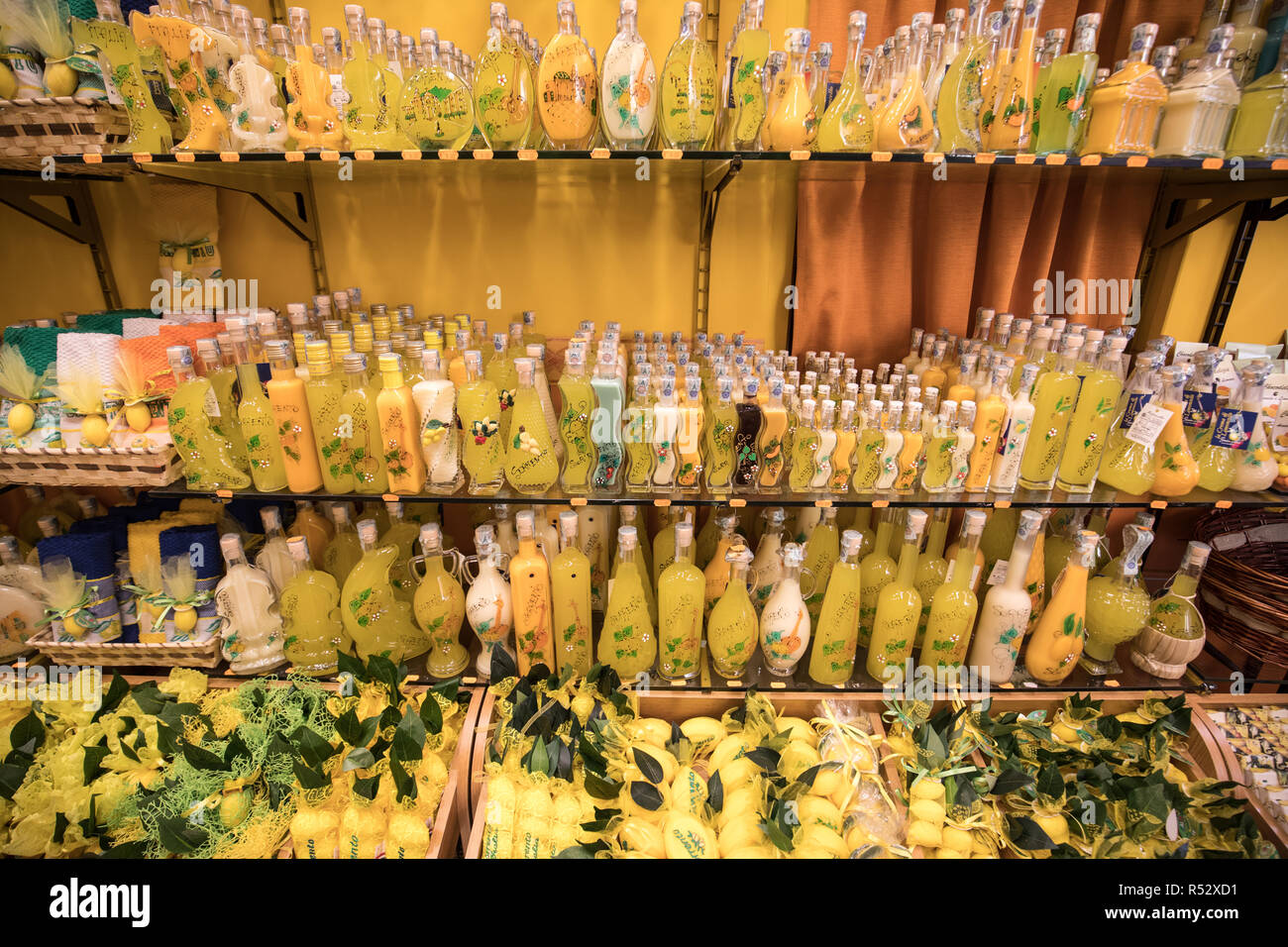 Sorrento, Italy June 12, 2017 Bottles of Limoncello and Lemon