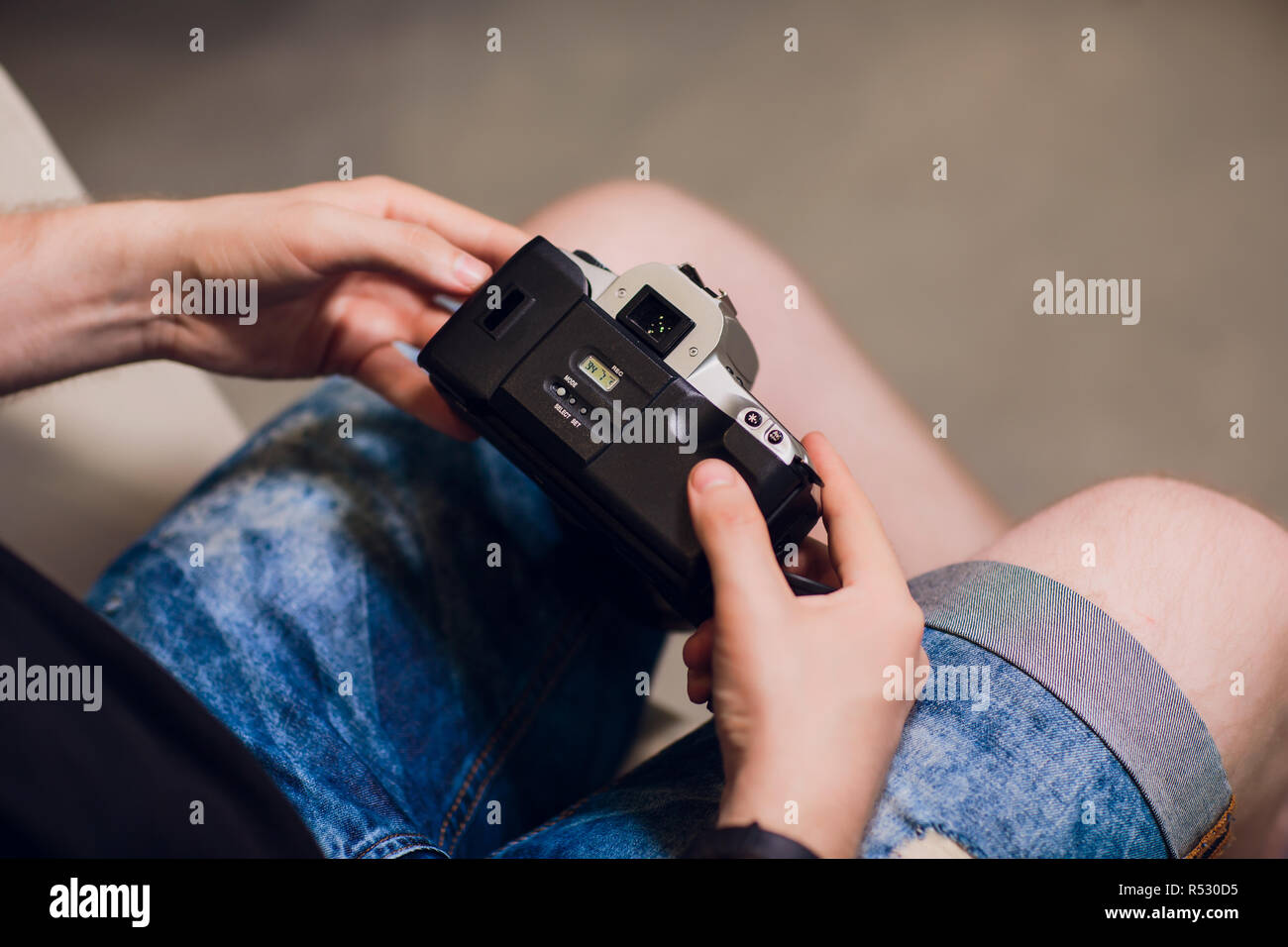 man installing photo film cartridge in film camera Stock Photo Alamy