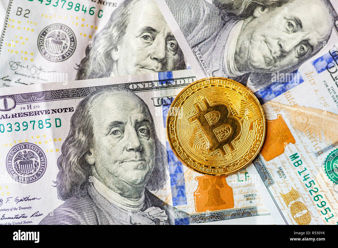 Virtual Money Golden Bitcoin On Hundred Dollars Bills Background - 