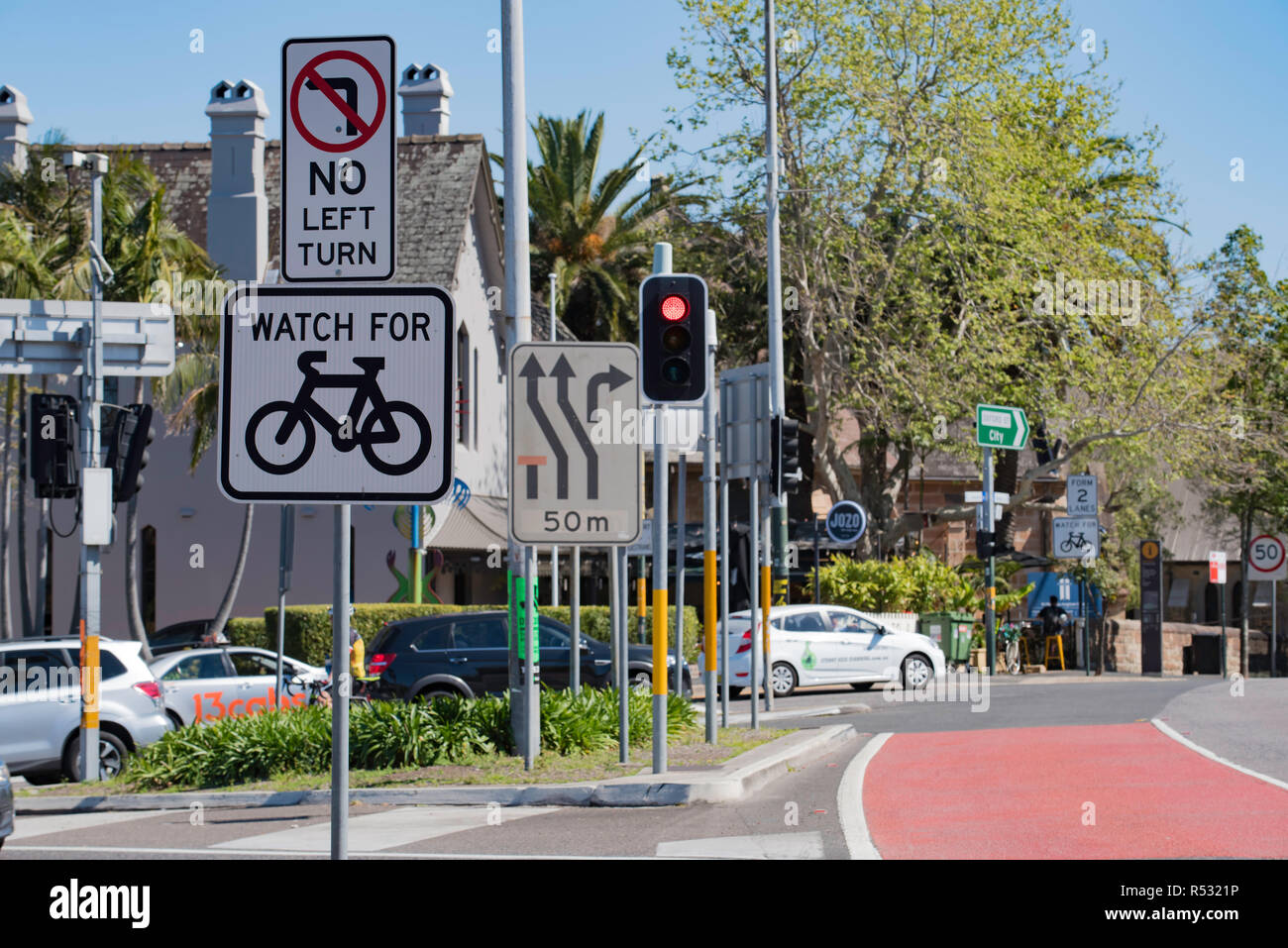 A concentration of road signs at a busy intersection in Paddington, Sydney Australia Stock Photo