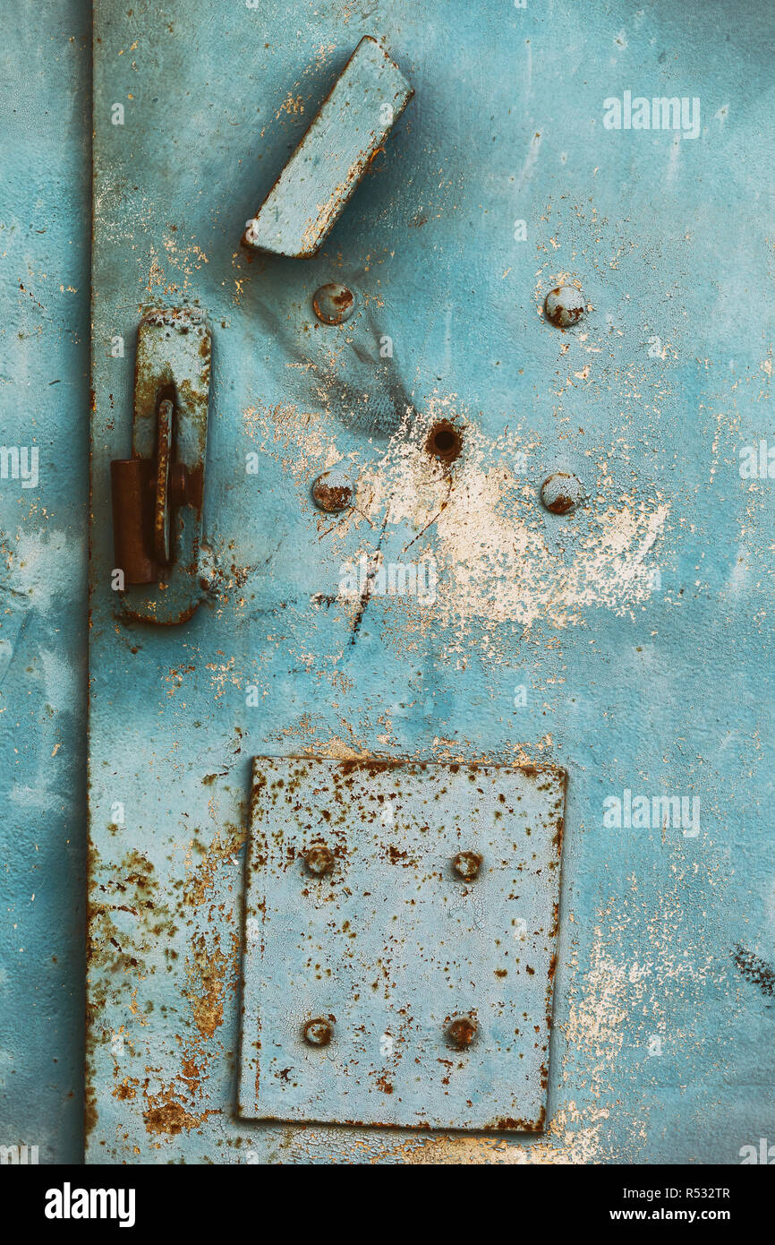Texture of surface of rusty metal garage with cracked paint Stock Photo