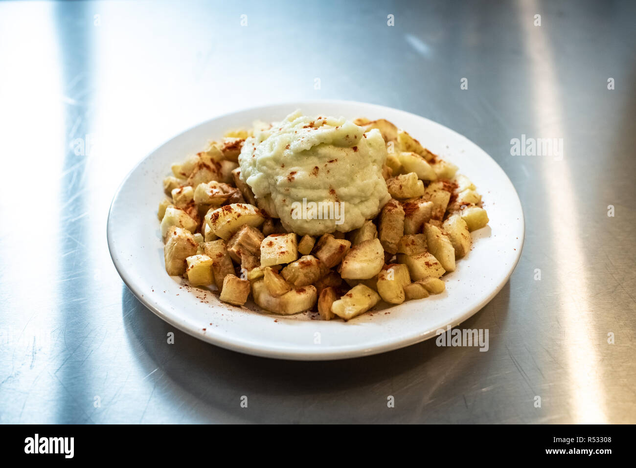 Yuca fried with hummus sauce. Stock Photo