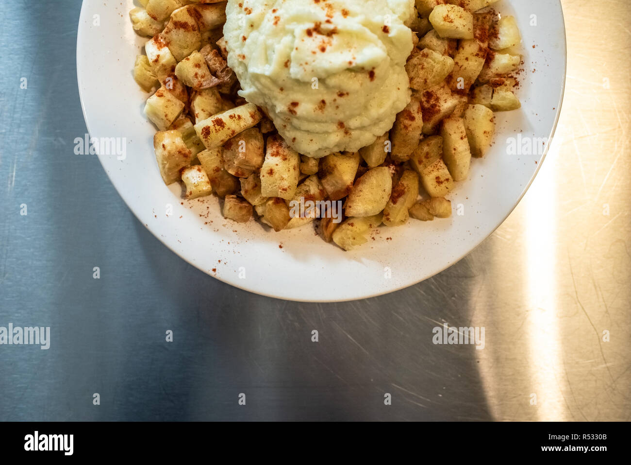 Yuca fried with hummus sauce. Stock Photo
