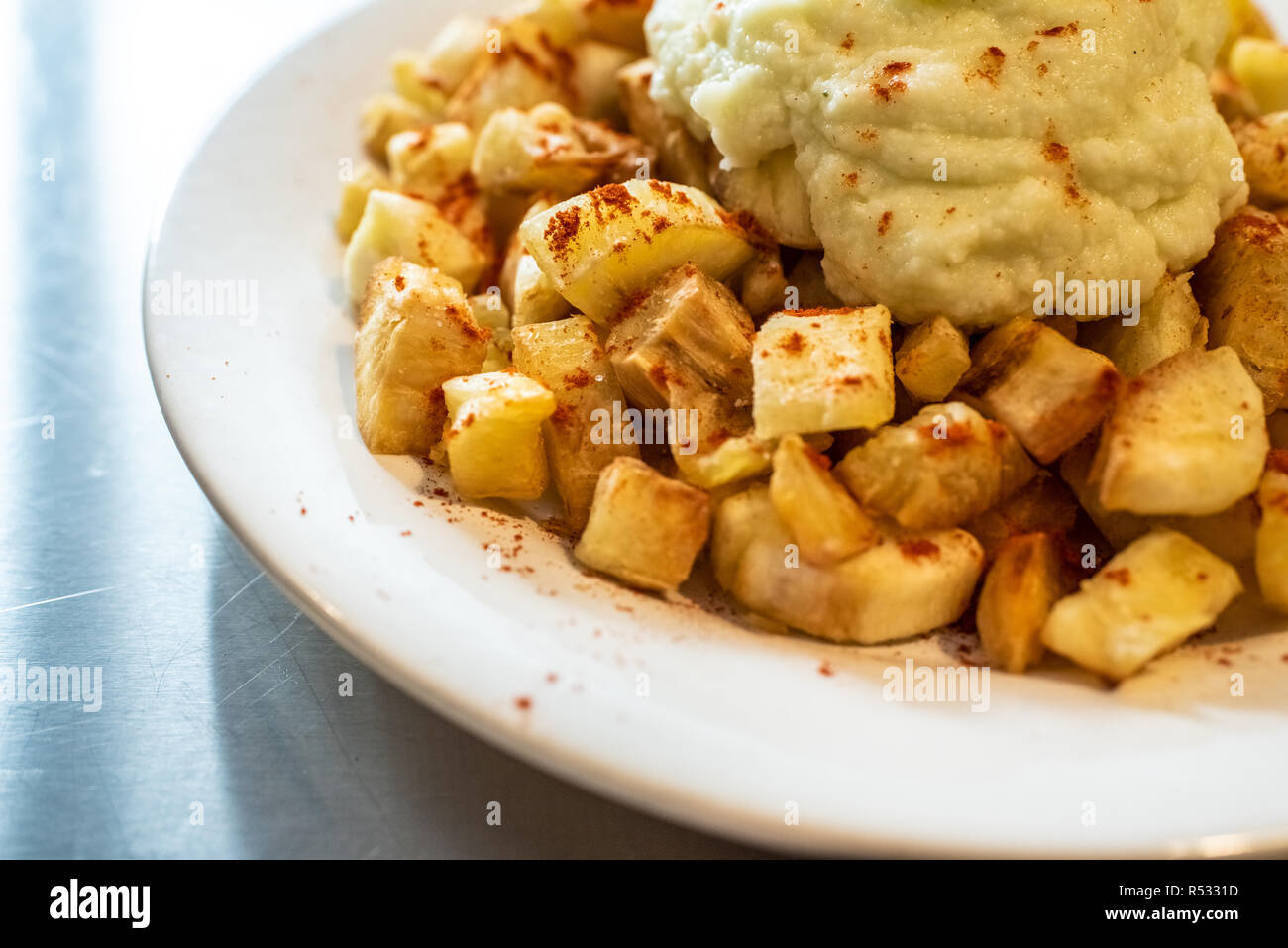 Yuca fried with hummus sauce. Stock Photo