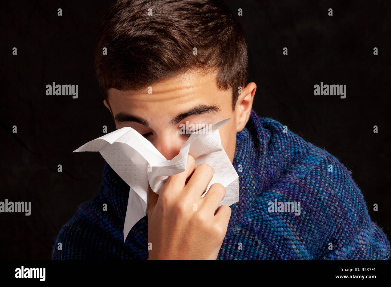young boy who blows his nose Stock Photo