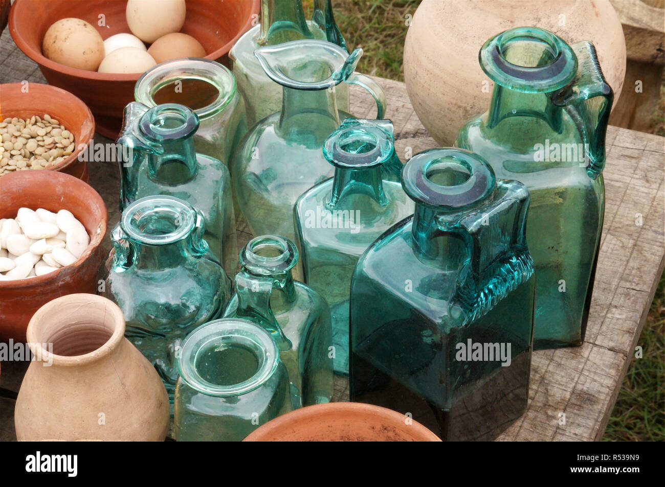 Roman glass jars and bottles to hold oils and sauces for cooking. Stock Photo