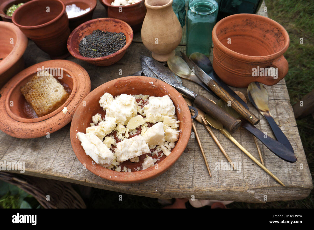 A display of Roman food and cooking utensils. Stock Photo