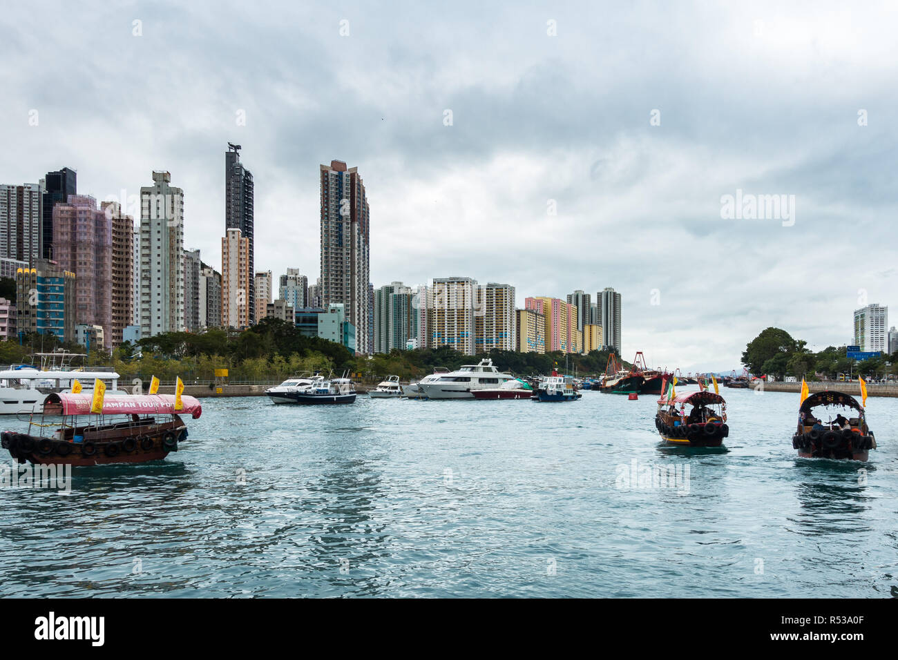 Sampan ride is a popular tourist activity to explore Aberdeen habour and the floating village where people live on house boats, Hong Kong Stock Photo