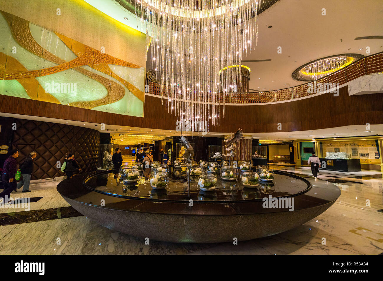 Main lobby of Grand Lisboa hotel and casino, showing luxury collections and a big chandelier. Macau, January 2018 Stock Photo