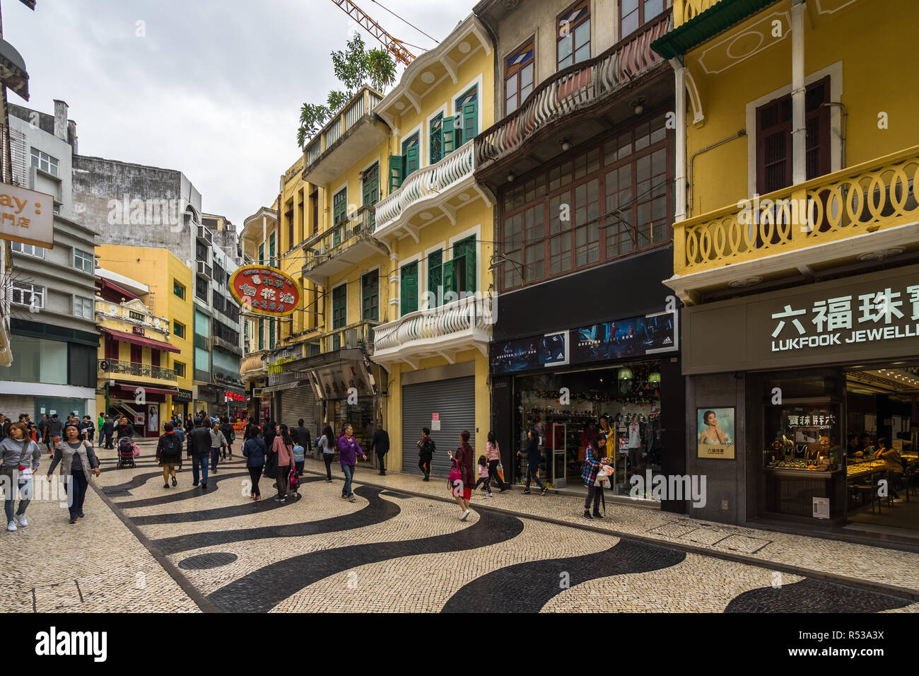 Tourists and shoppers wander around at historic centre of Macau. Macau, January 2018 Stock Photo