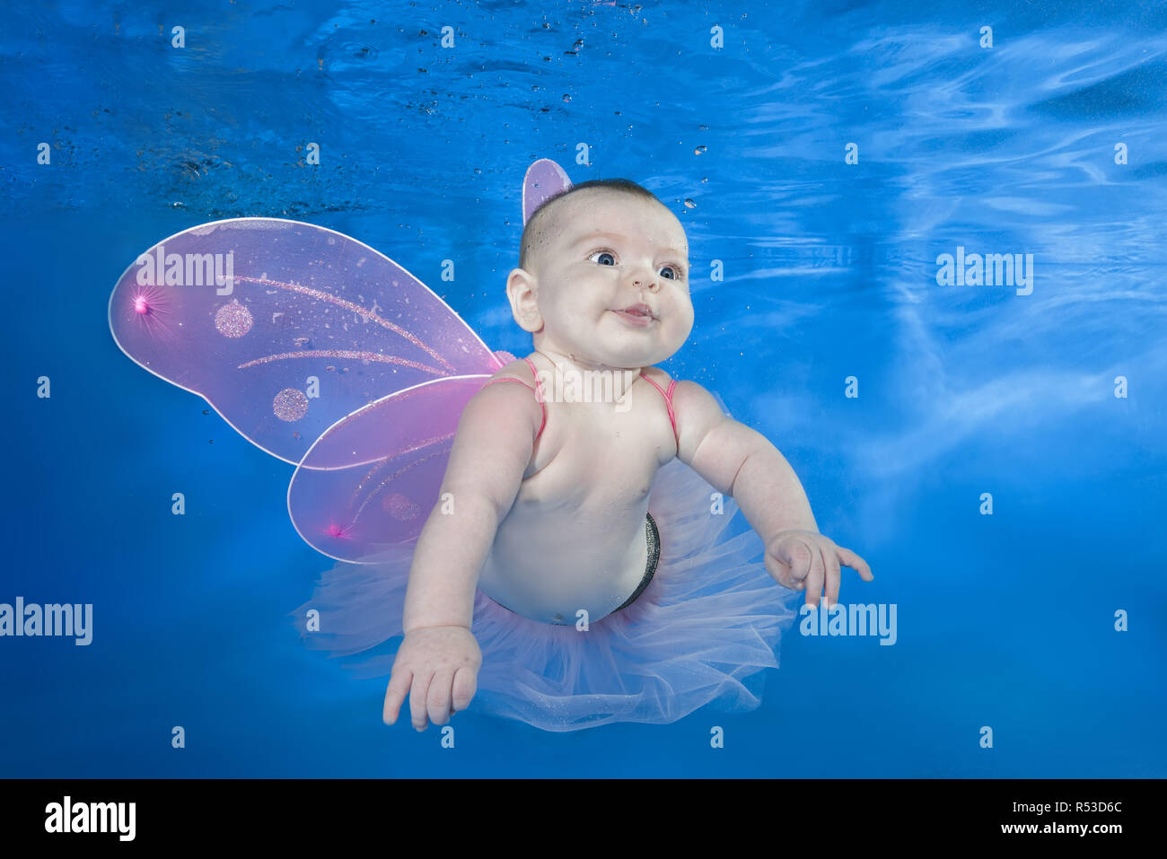 Beautiful Baby Girl In Fairy Costume Swim Underwater On Blue Water Background Healthy Family Lifestyle And Children Water Sports Activity Child Deve Stock Photo Alamy