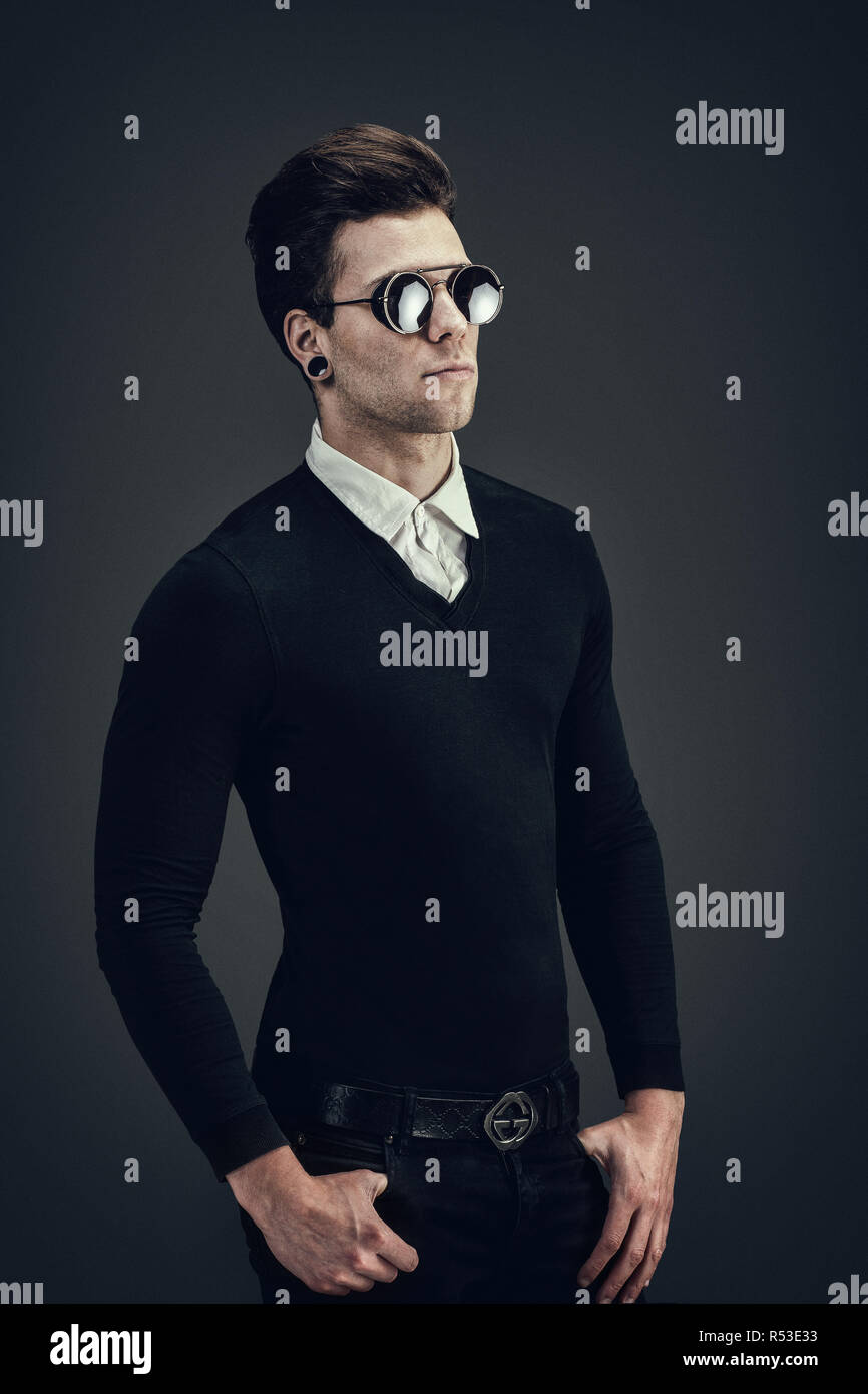 Portrait of a young man wearing sunglasses Stock Photo