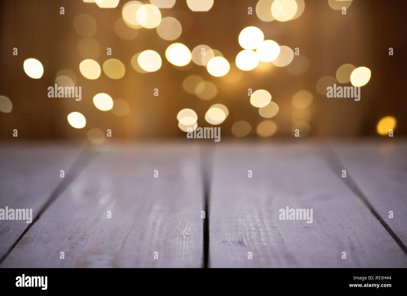 Christmas Bokeh background with empty wooden Stock Photo