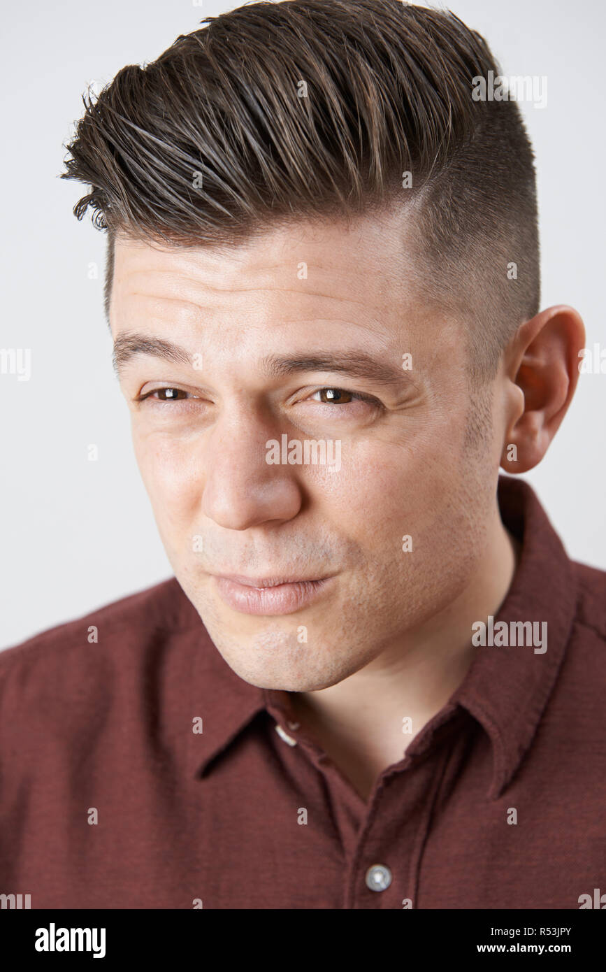 Man With Poor Eyesight Squinting Into Distance Stock Photo