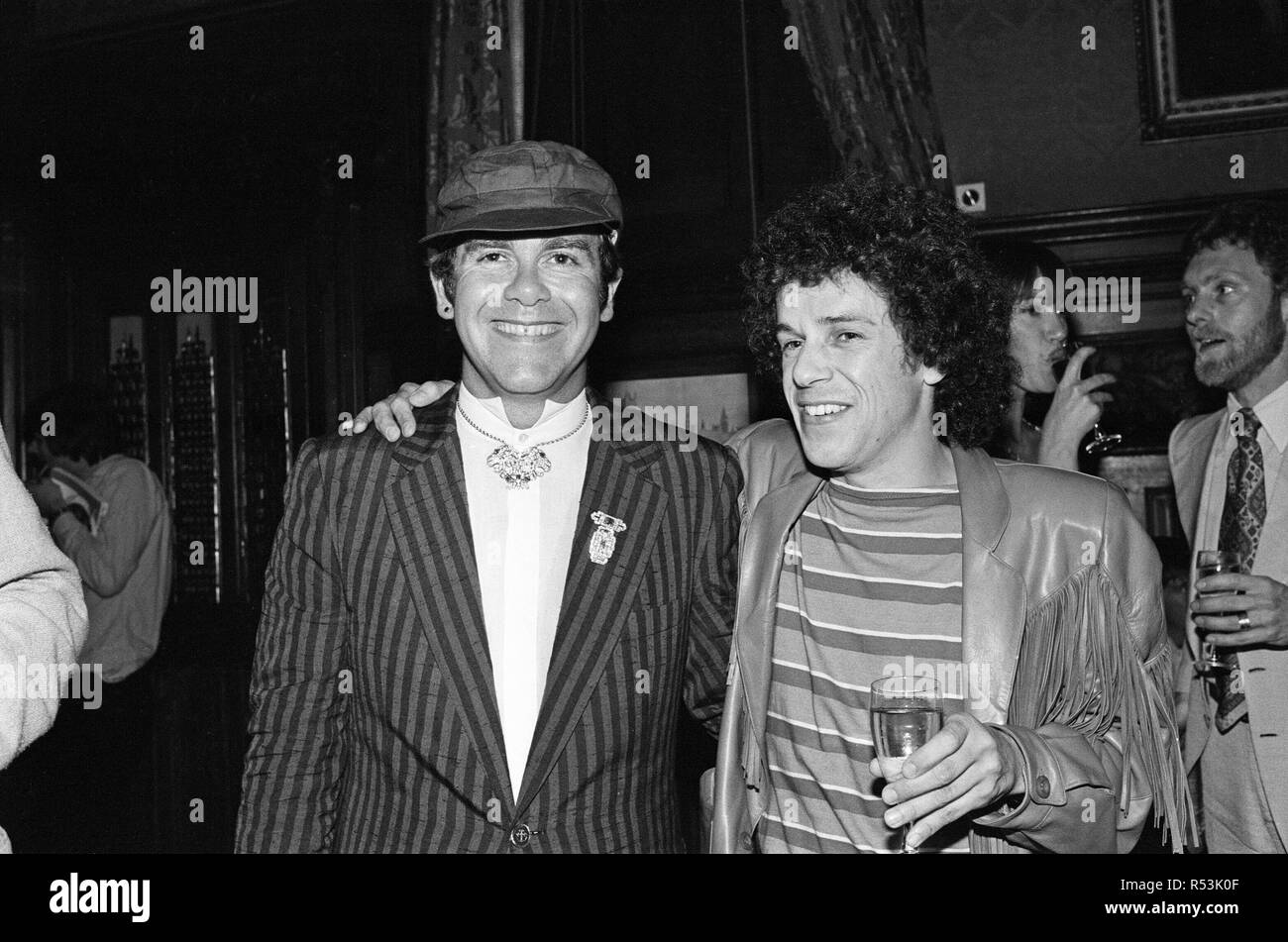 Elton John and Leo Sayer attending a House of Commons reception, invited along with other pop stars by the Minister for the Arts , Norman St John-Stevas. 3rd August 1980. Stock Photo