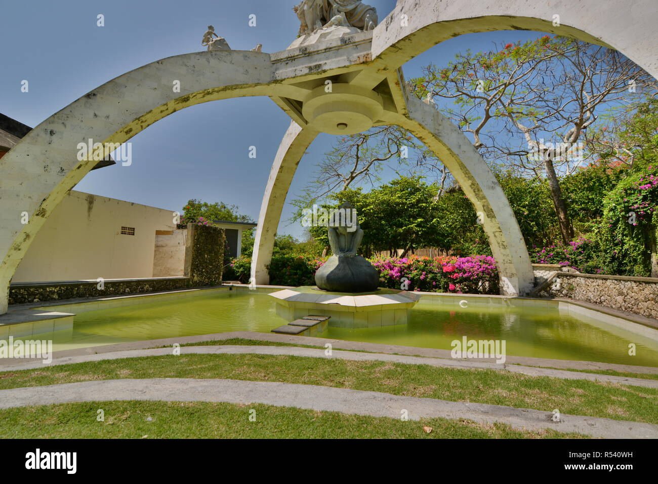 Kumbhakarna Laga statue and fountain. Pura Luhur Uluwatu. Bali