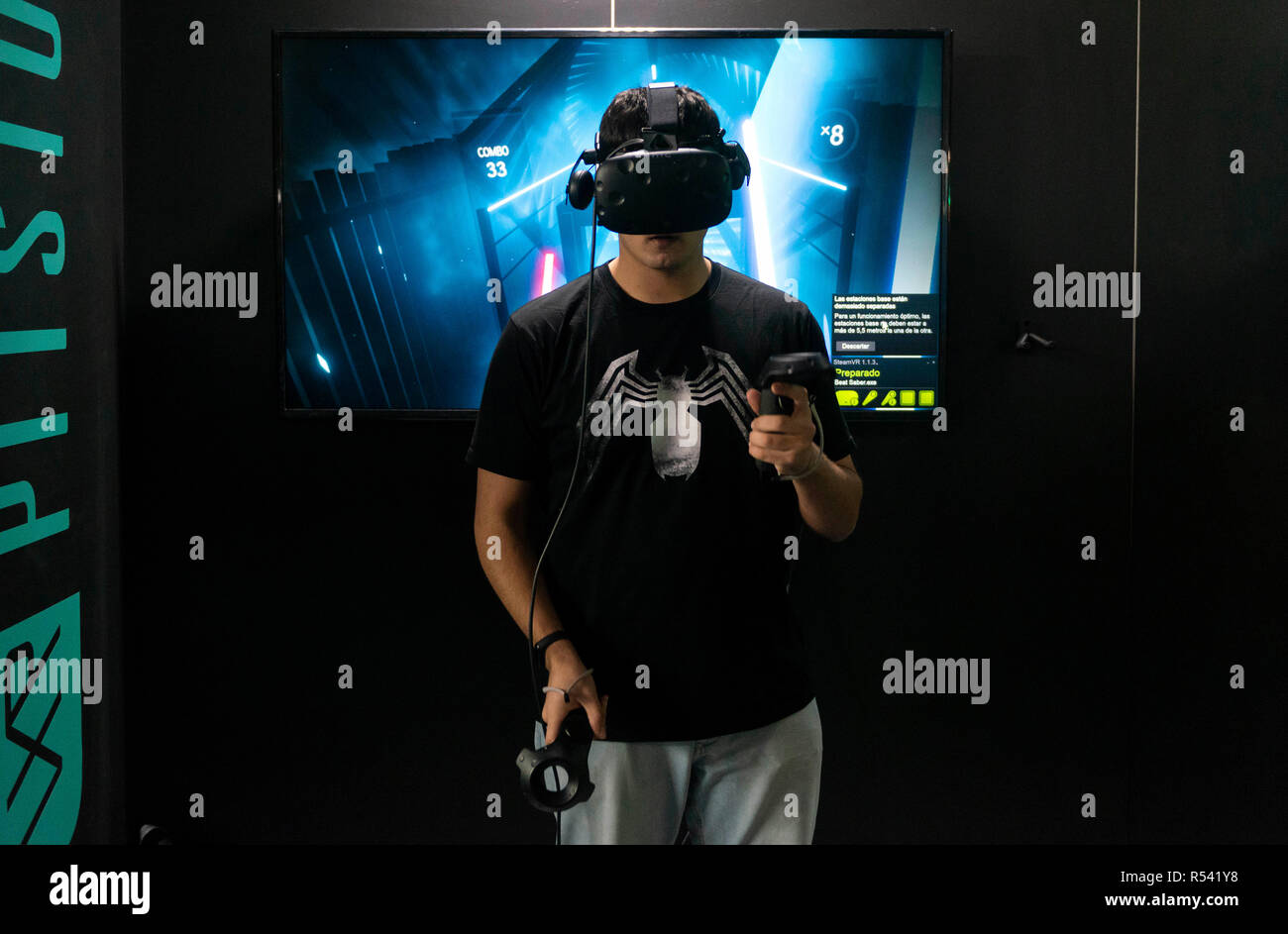 Barcelona, Spain. 29th November, 2018. A man playing video games with 3D virtual reality glasses during the Barcelona Games World 2018 at Gran Via Fira on November 28, 2018 in Barcelona, Spain. © Victor Puig/Alamy Live News Stock Photo