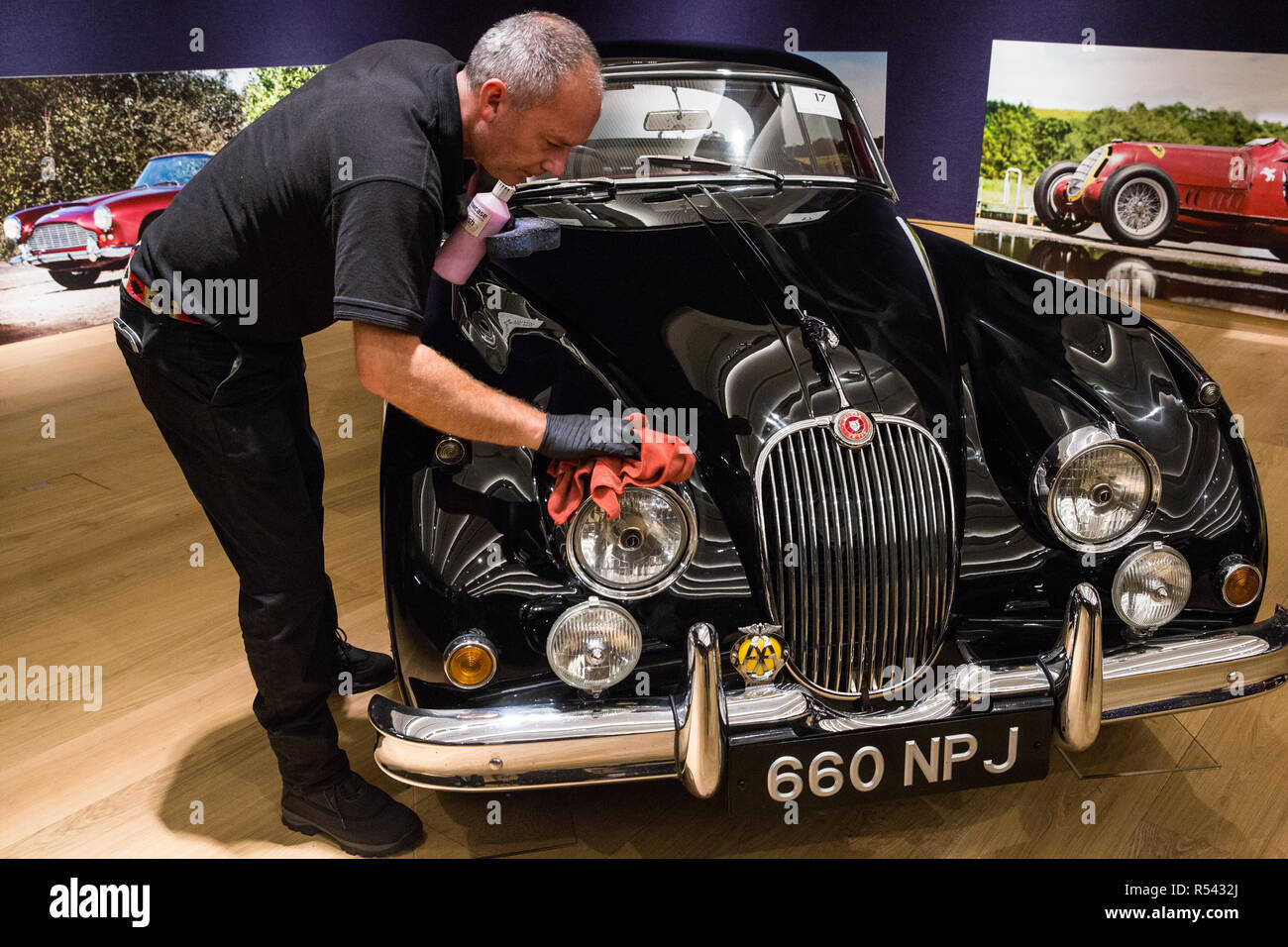 London, UK. 29th November, 2018. Bonhams' staff prepare a 1960 Jaguar XK150 'S' 3.8-Litre Coupé, one of only 115 right-hand drive vehicles made, in preparation for an auction of historic and high-performance racing and road cars. Highlights include a Le Mans class-winning Jaguar XJ220C driven by David Coulthard (£2,200,000-2,800,000), a Lister Jaguar Knobbly (£2,200,000-2,800,000) and a 1958 BMW 507 owned by its designer, as well as Ferraris, Aston Martins, Bentleys, Porsches and Jaguars. Credit: Mark Kerrison/Alamy Live News Stock Photo